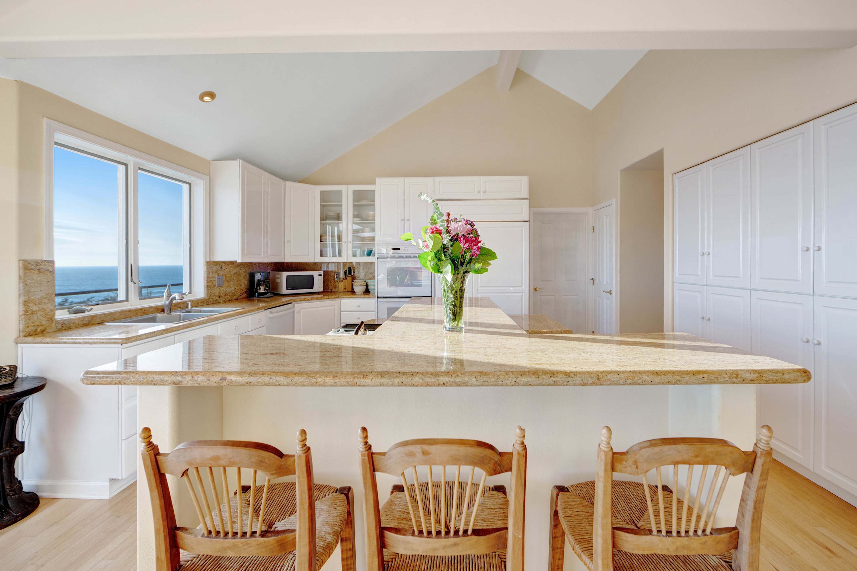 Cook up your favorite meals in the well-appointed kitchen while taking in the gorgeous coastal scenery outside.