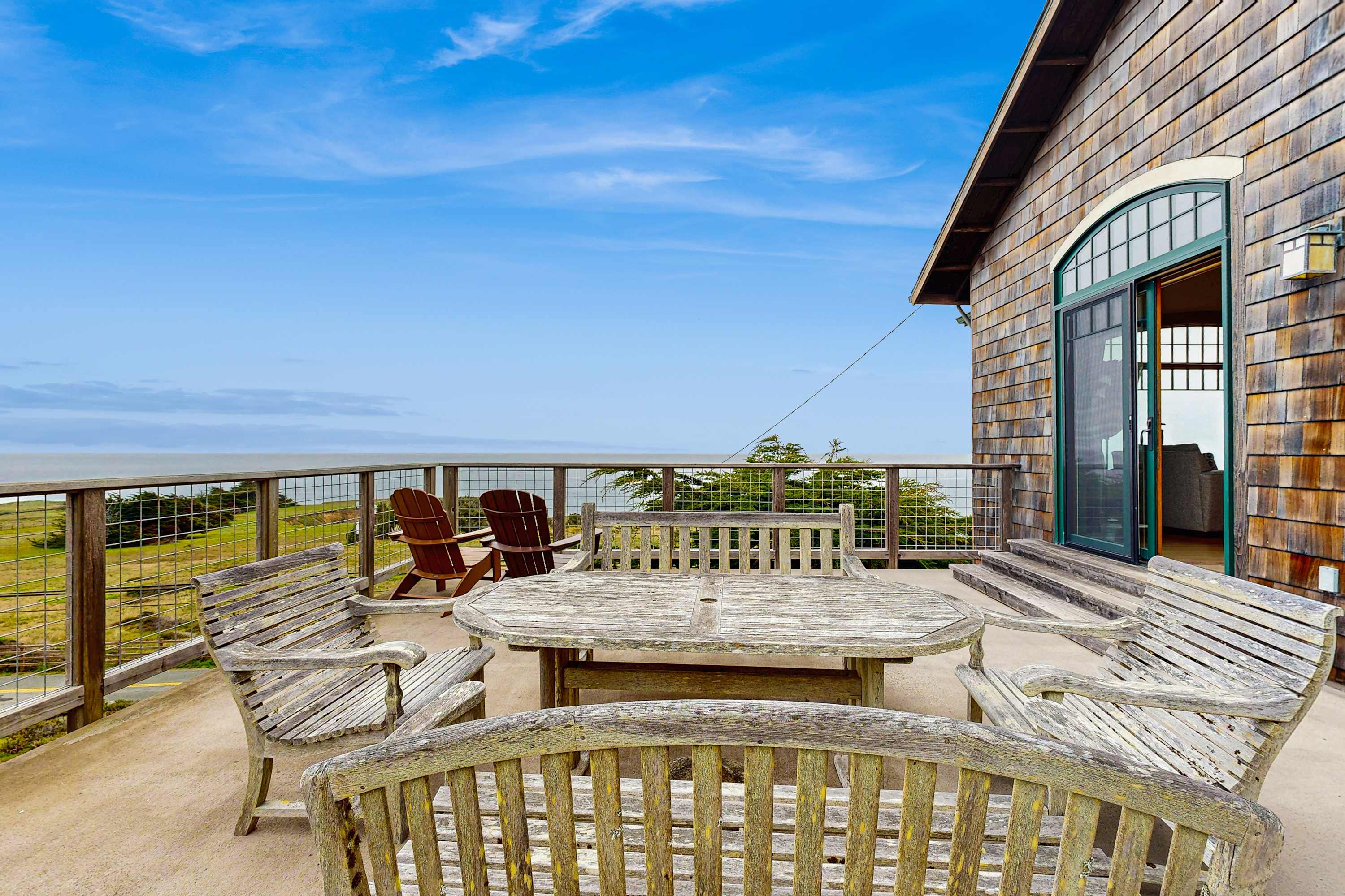 Breathe in the fresh ocean air from the spacious deck, a serene escape for relaxation and gatherings with friends and family.