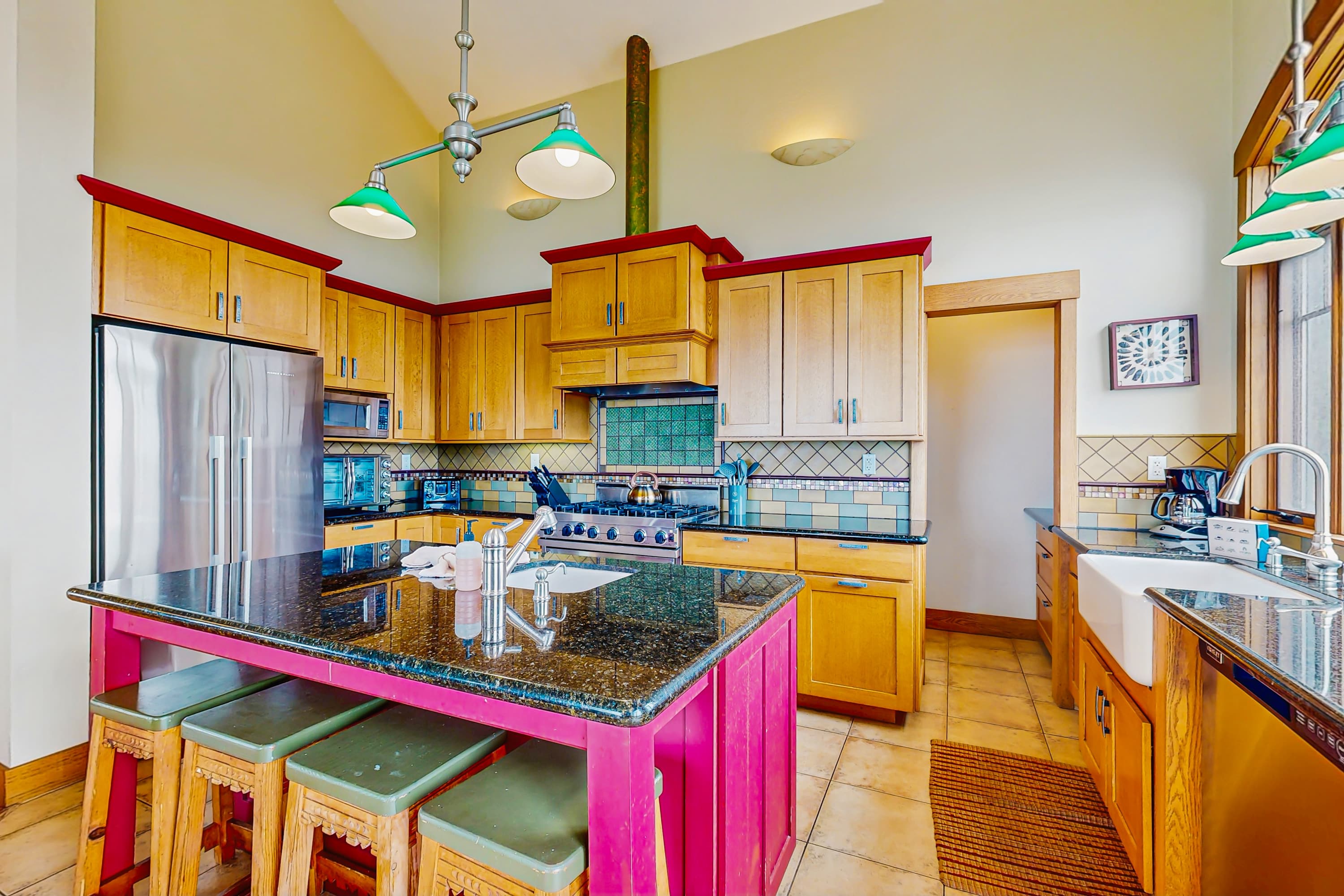 Unleash your culinary creativity in this vibrant kitchen, complete with modern appliances and ample space for preparing delicious meals with ocean views.