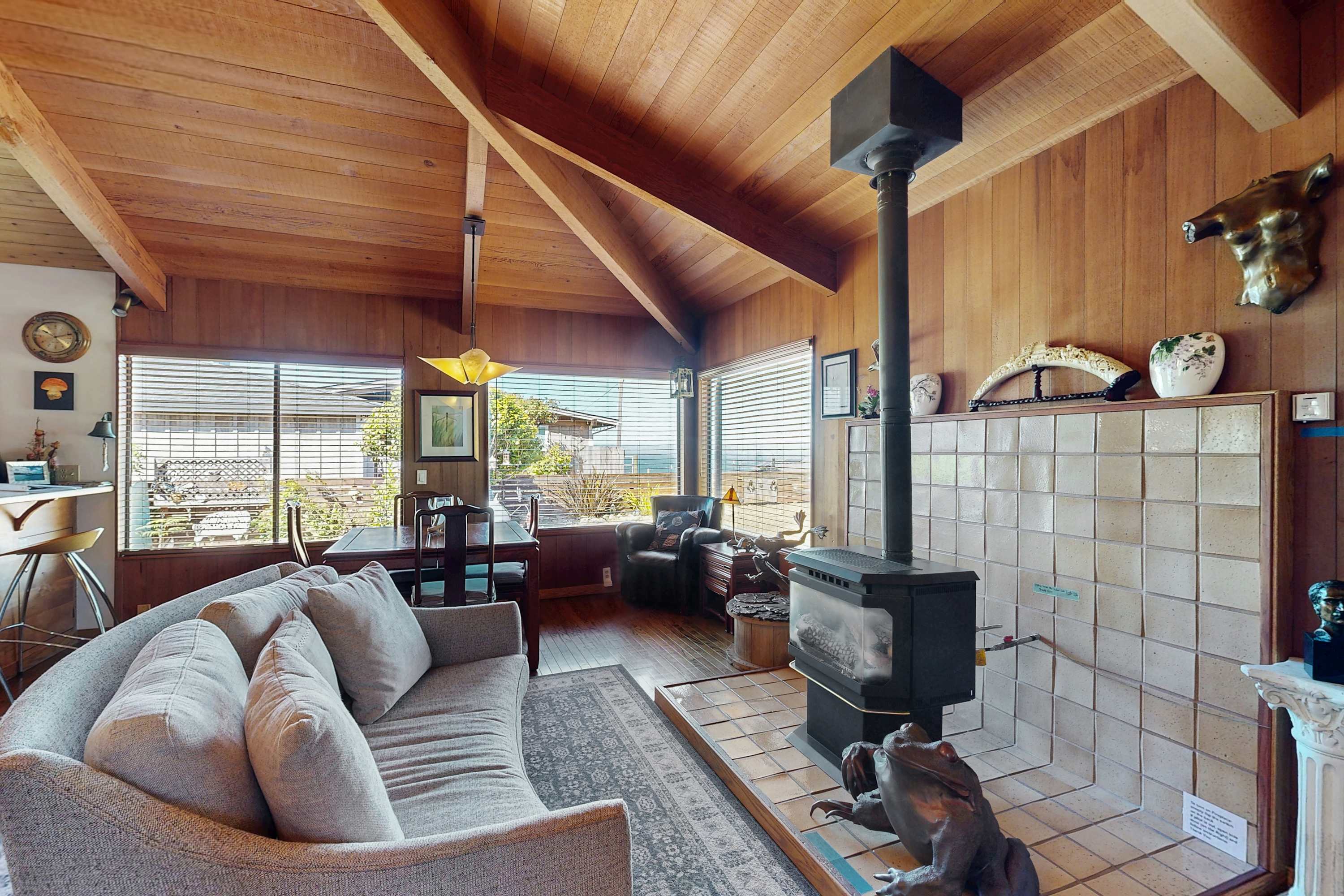 Bask in the warmth of the gas fireplace after a day of exploring, as the inviting living room invites relaxation and connection.