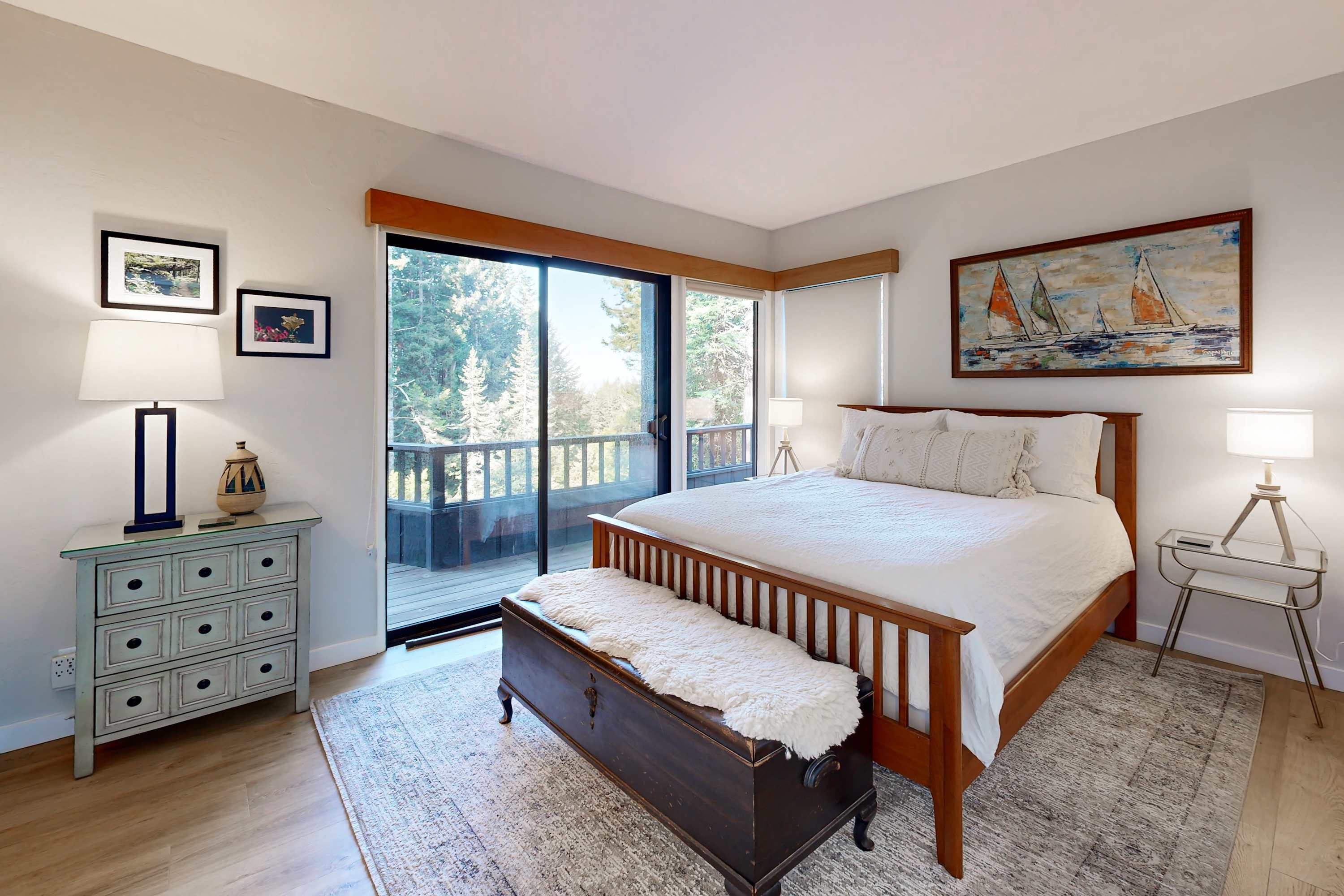 Awaken in the master bedroom, where serene views and elegant decor create a peaceful retreat, just steps away from your private deck.