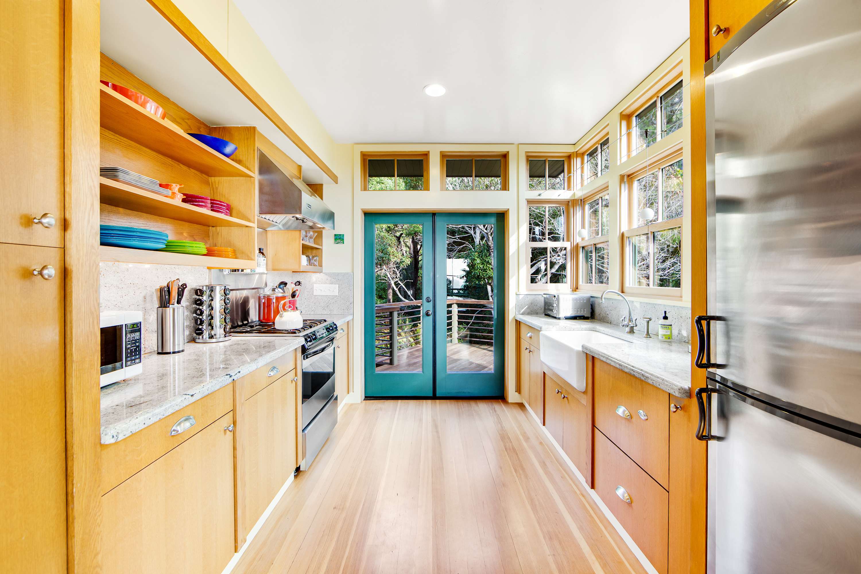Cook up your favorite meals in this well-equipped kitchen, where natural light makes every culinary adventure a delight.