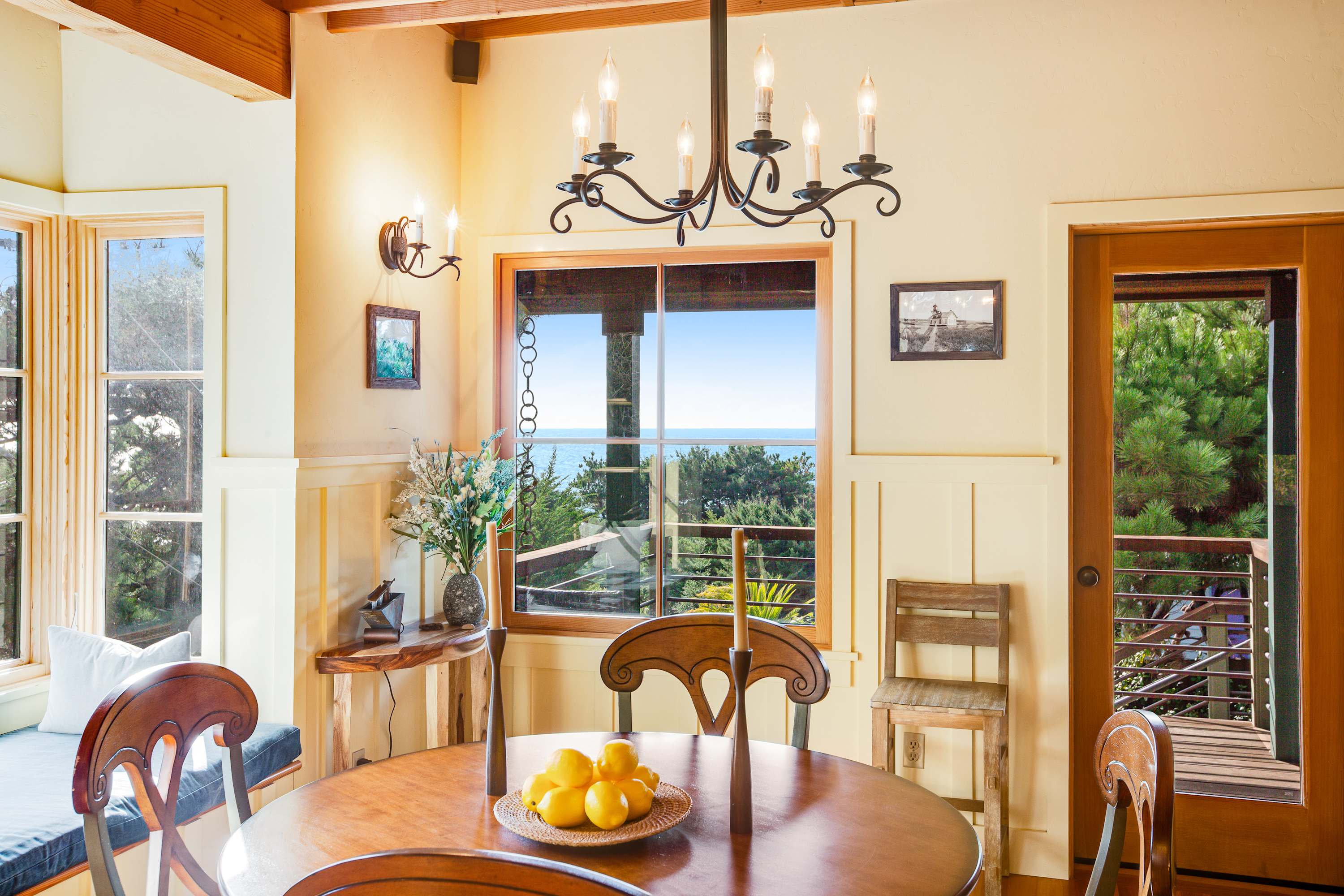Imagine sipping your morning coffee at this charming dining table, framed by stunning coastal views.