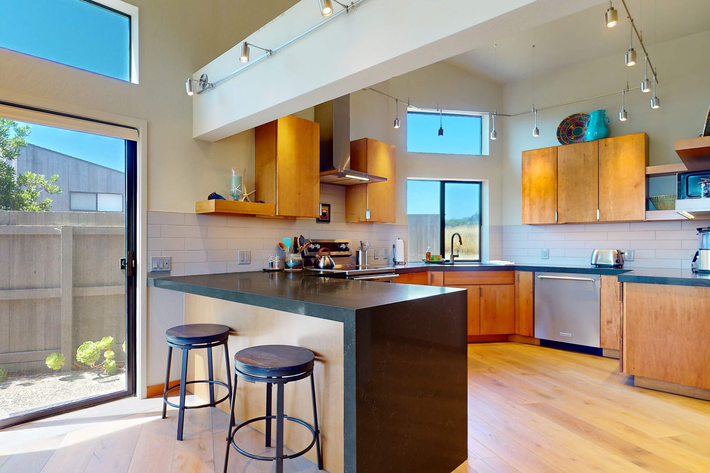 Craft culinary delights in this modern kitchen, where sleek design meets functionality for your cooking adventures.