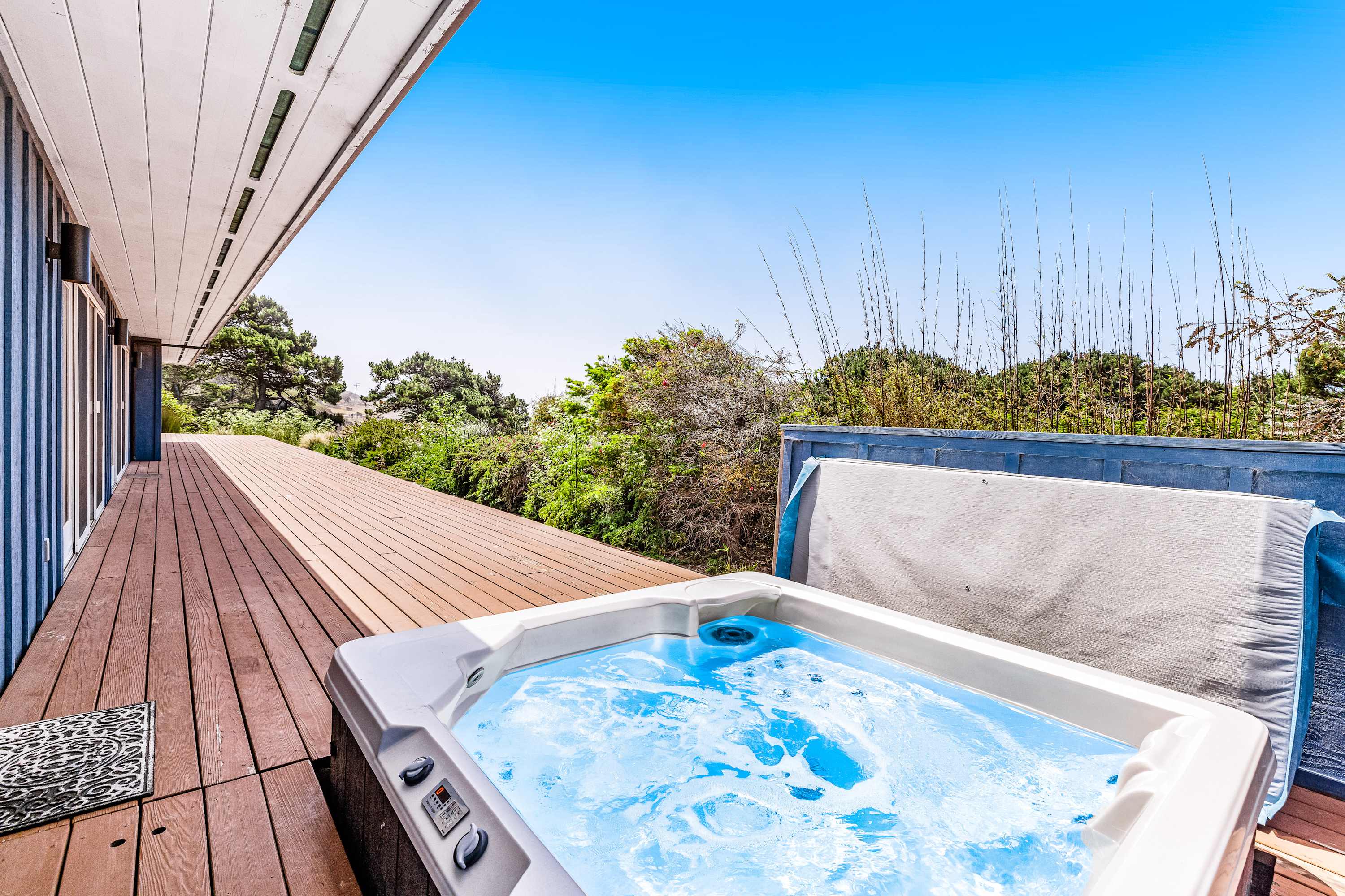 Step into relaxation in your private hot tub, a perfect way to unwind after a day exploring the stunning Gualala coastline.