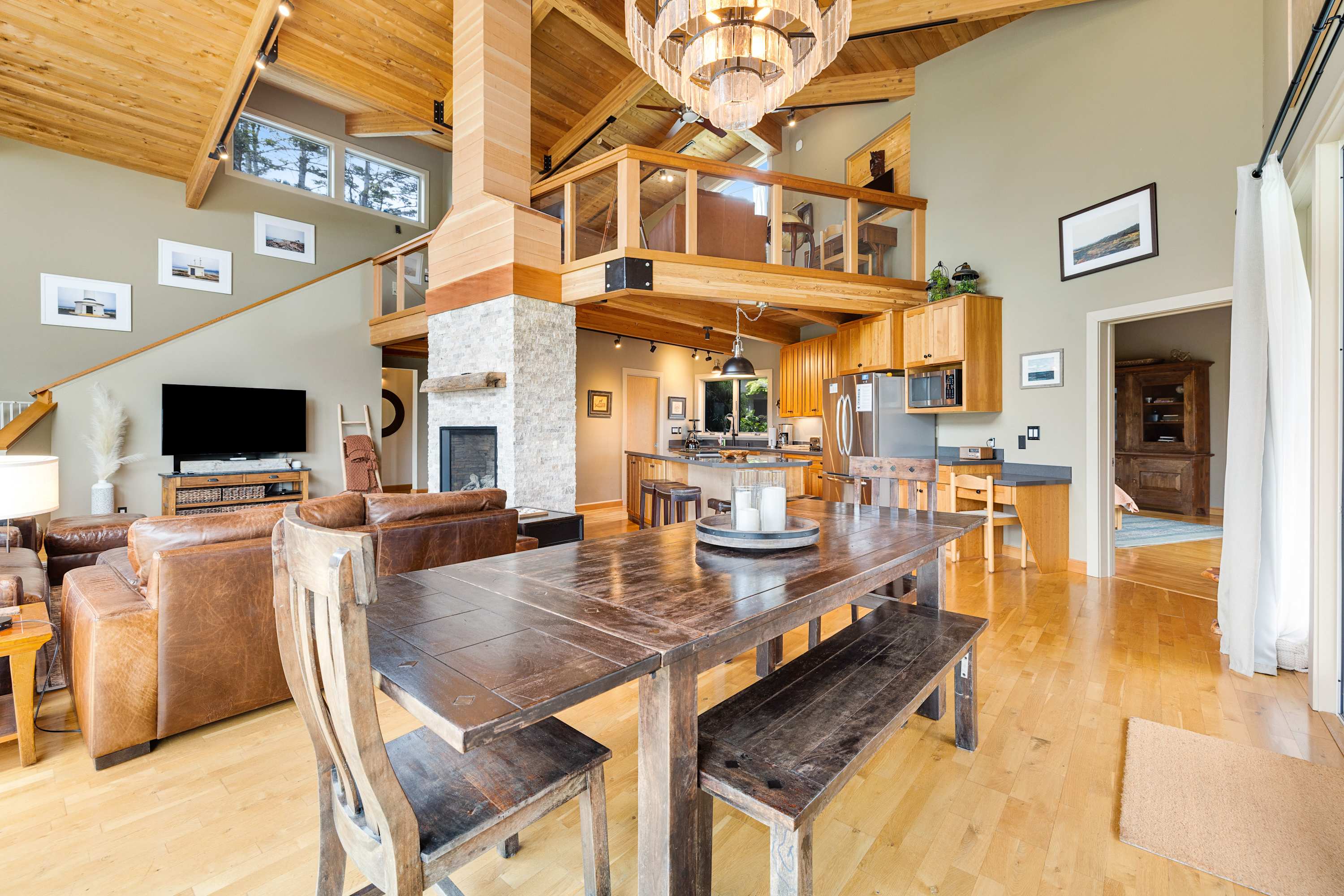 The open-concept living space invites you to enjoy quality time with family, surrounded by warmth and coastal charm.