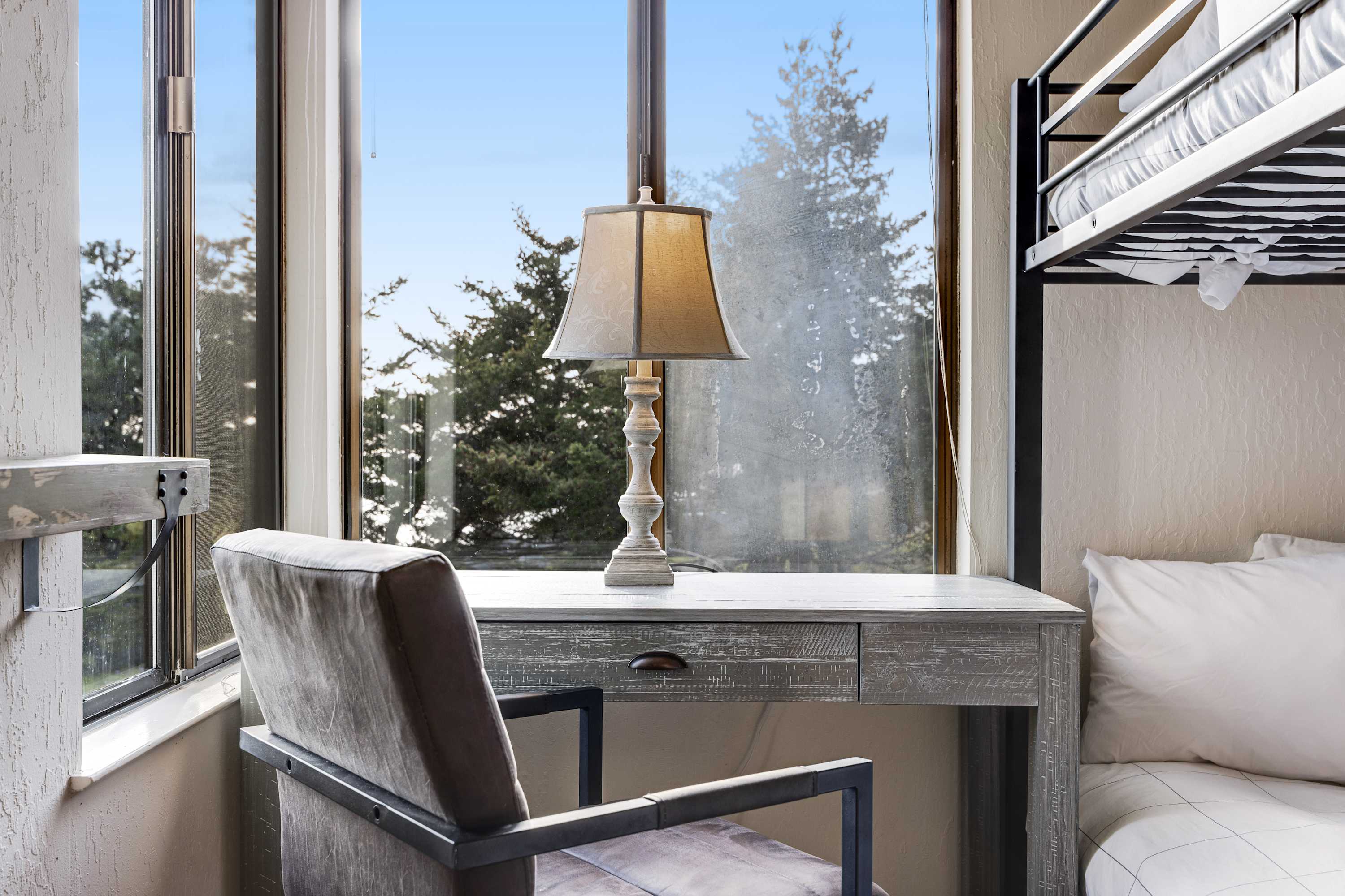 Serene workspace in the bunk room allows you to catch up on emails while soaking in the peaceful views.