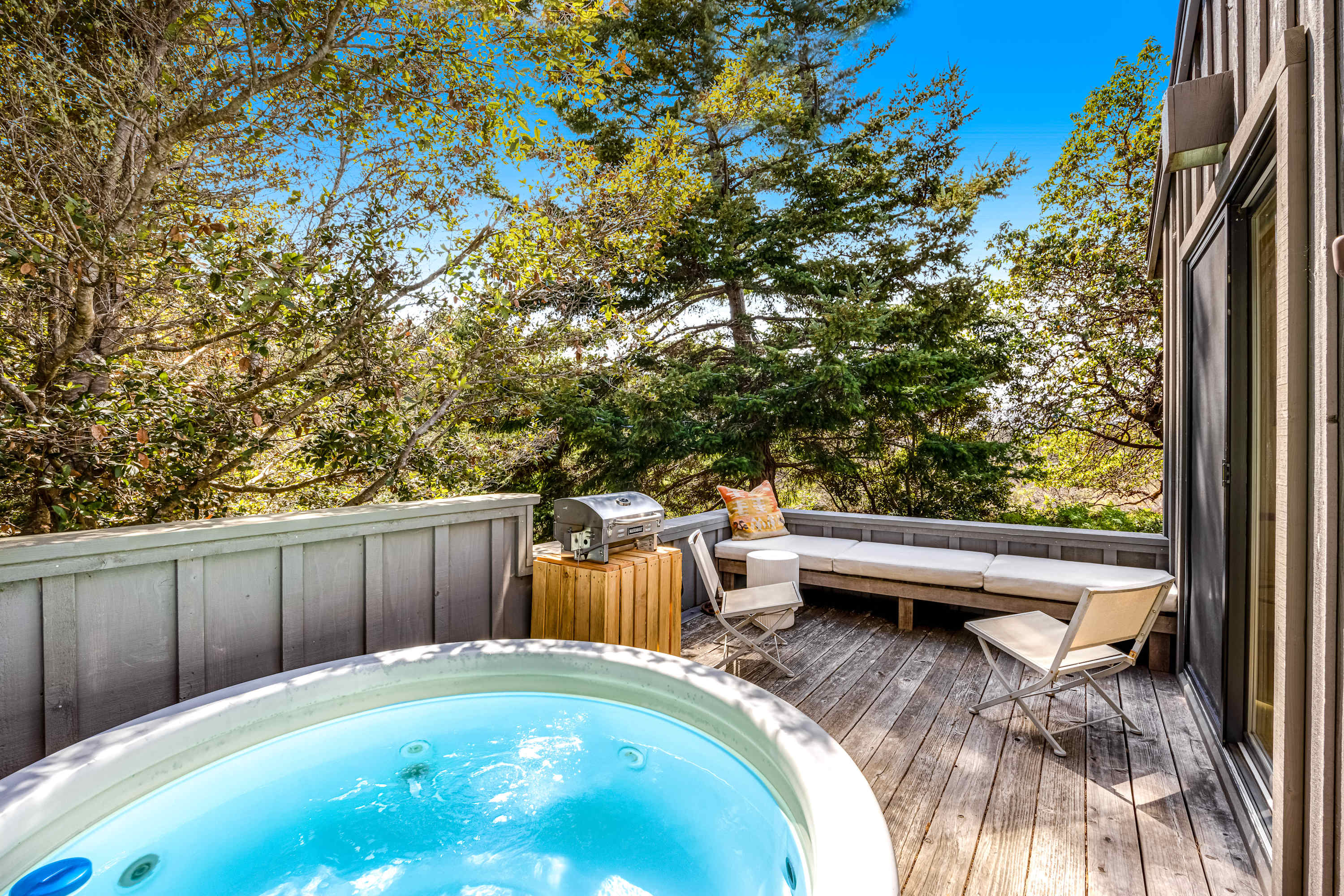 Step into your private hot tub oasis, where tranquility and nature surround you, perfect for unwinding after a day of adventures.