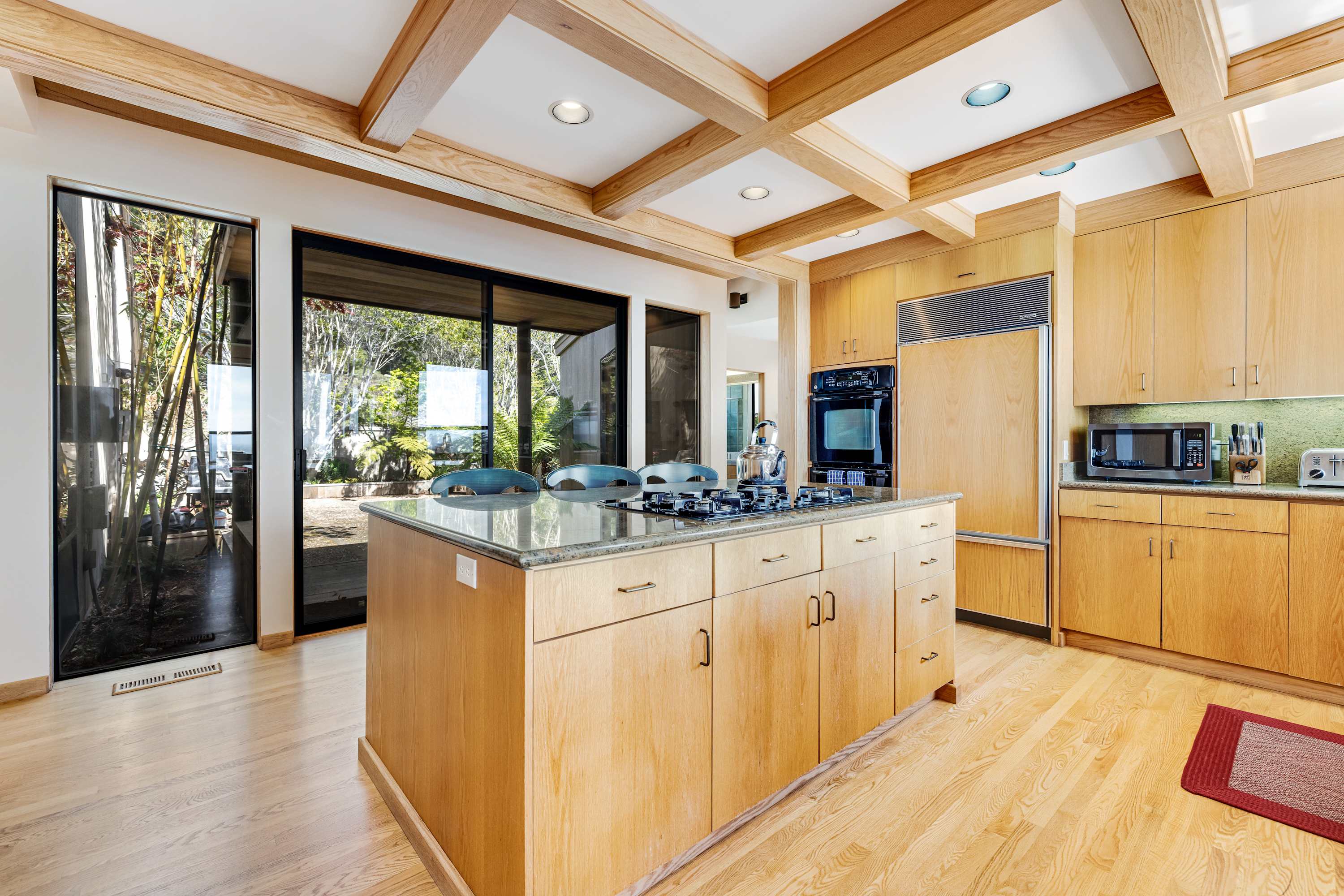 Cook up culinary delights in this well-appointed kitchen, designed for both functionality and breathtaking ocean vistas.