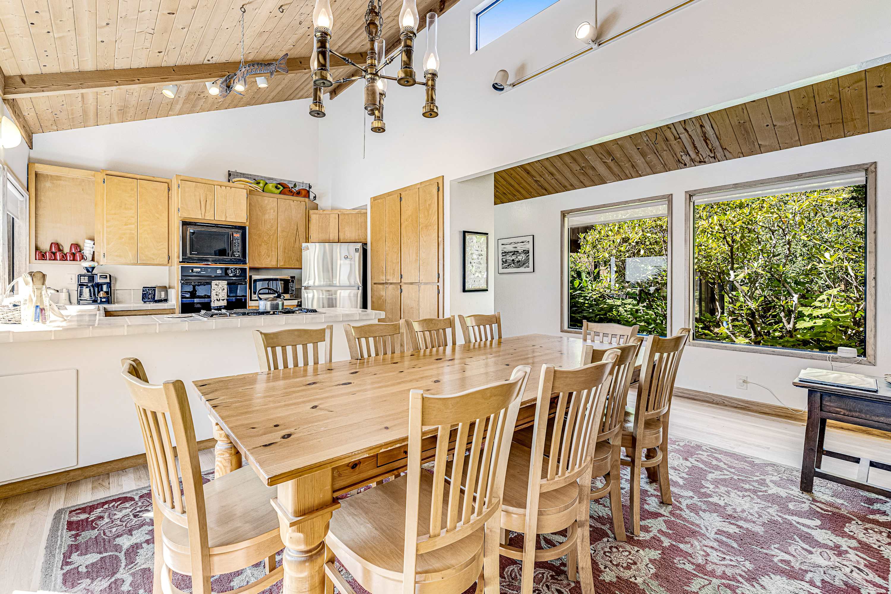 Share meals and laughter at the dining table, surrounded by nature’s beauty just outside the windows.