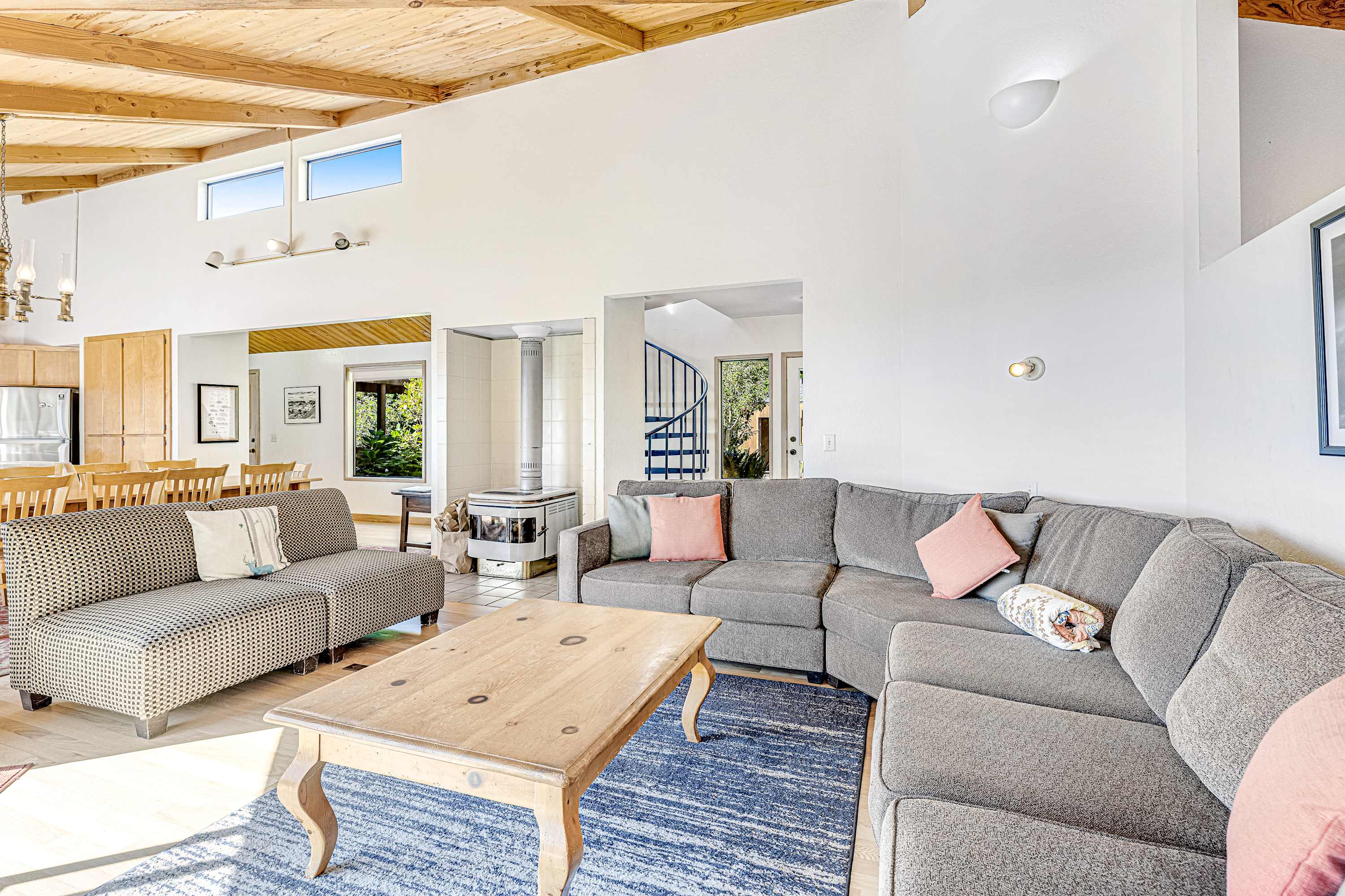 Gather around in this spacious living room, where stylish comfort meets stunning views through large windows.