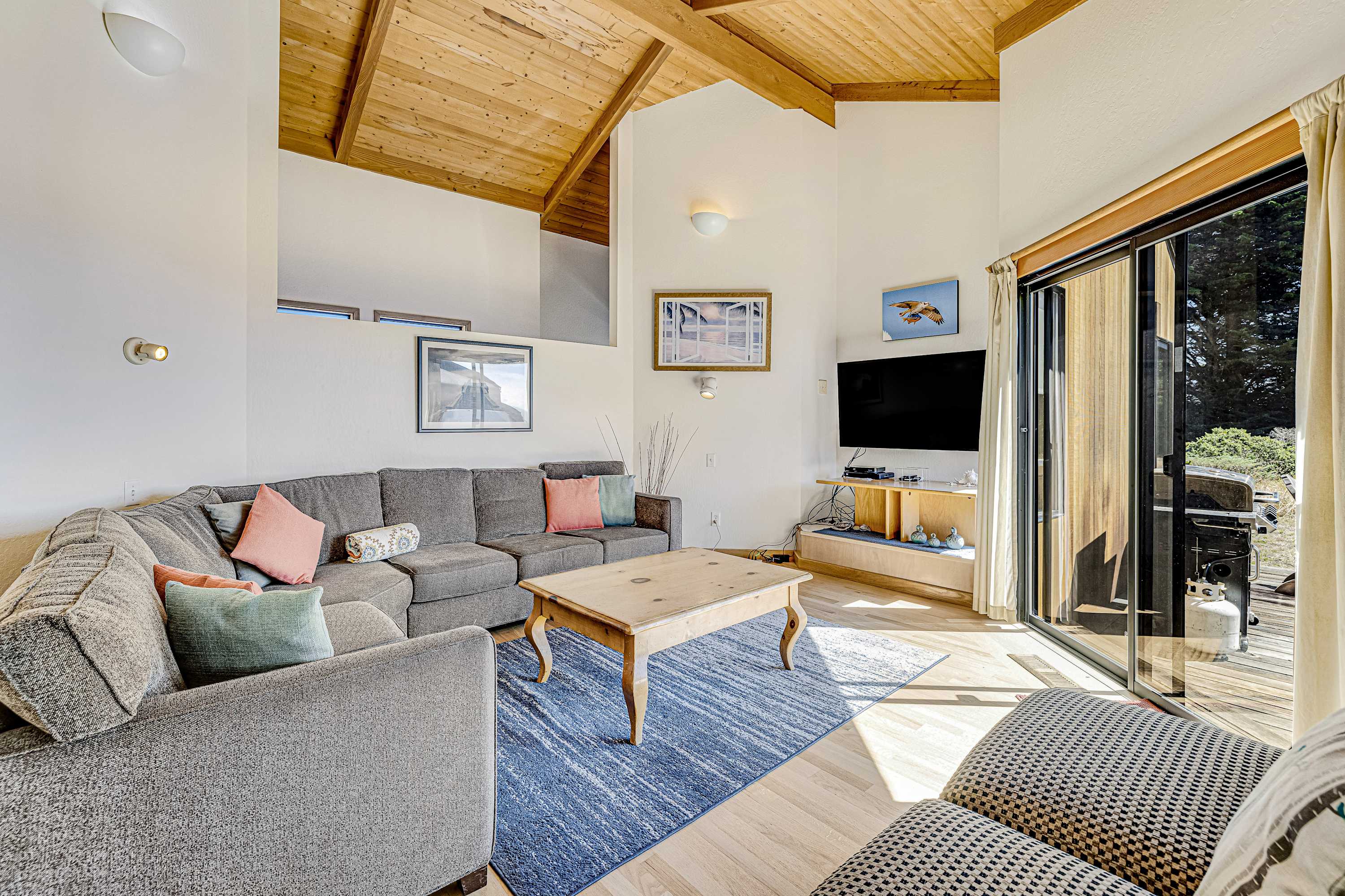 Morning light fills the living room, inviting you to relax with loved ones or enjoy a cozy movie night.