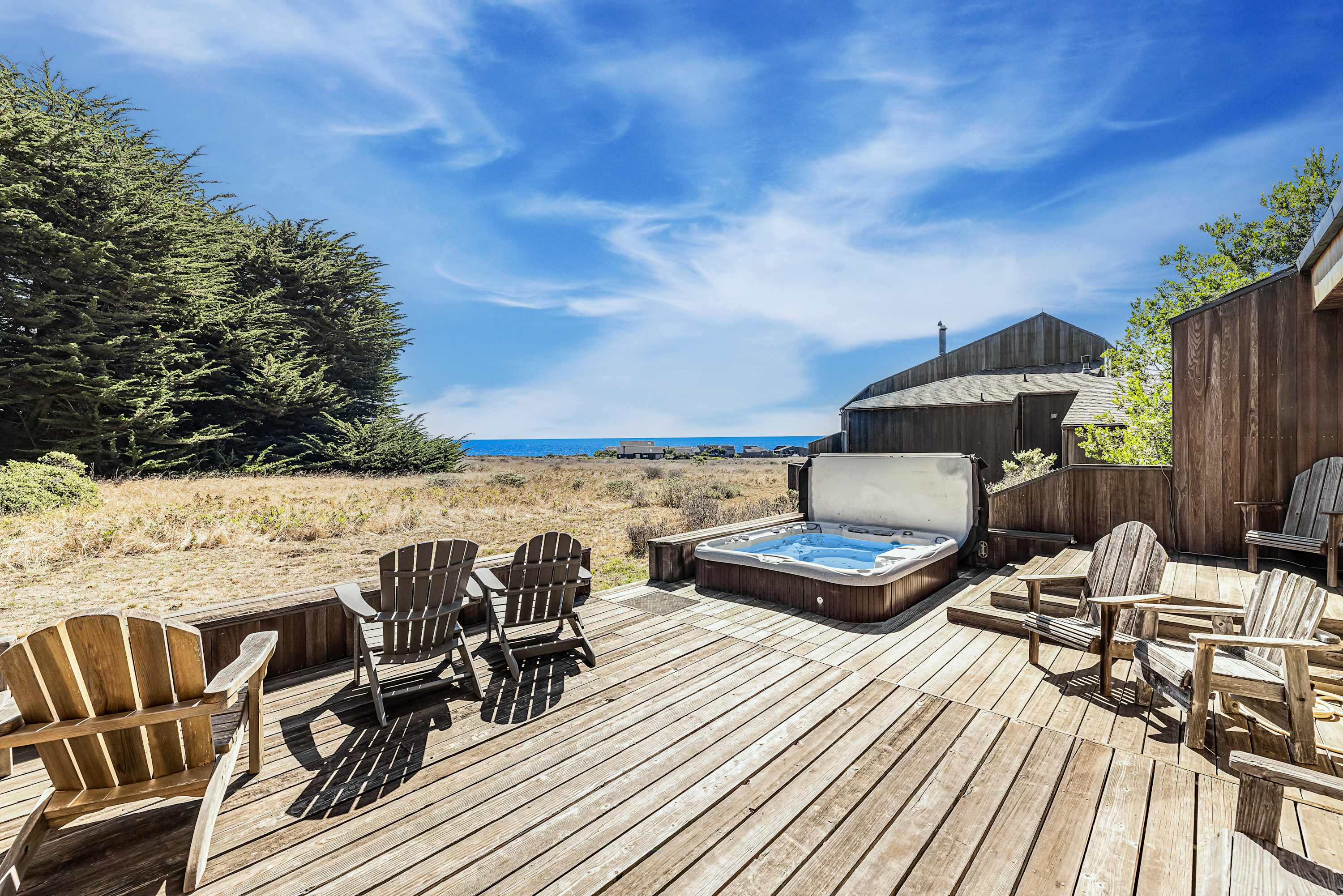Soak in your private hot tub while gazing at the endless ocean view—perfect for unwinding after a day of adventure.
