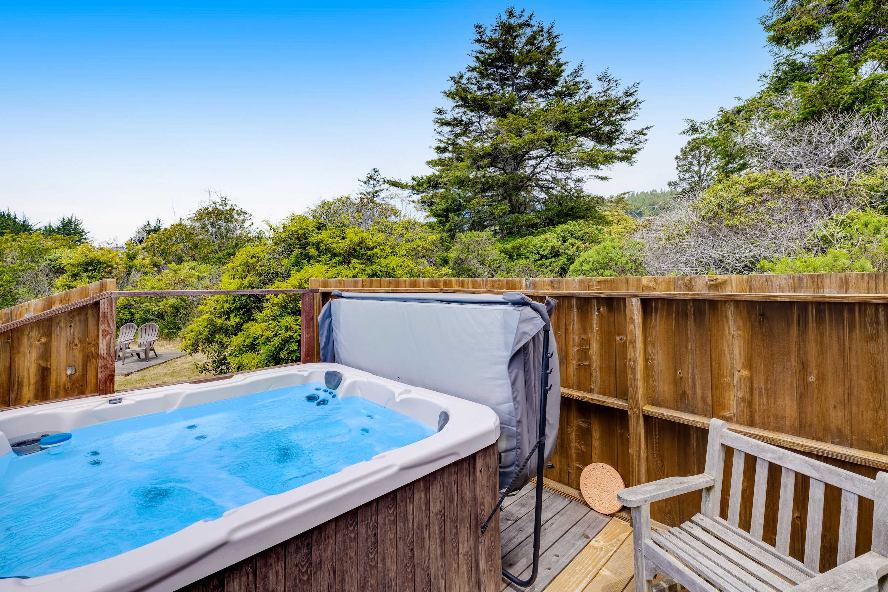 Let the bubbles of your hot tub massage away the day's adventures while you take in the serene coastal landscape.