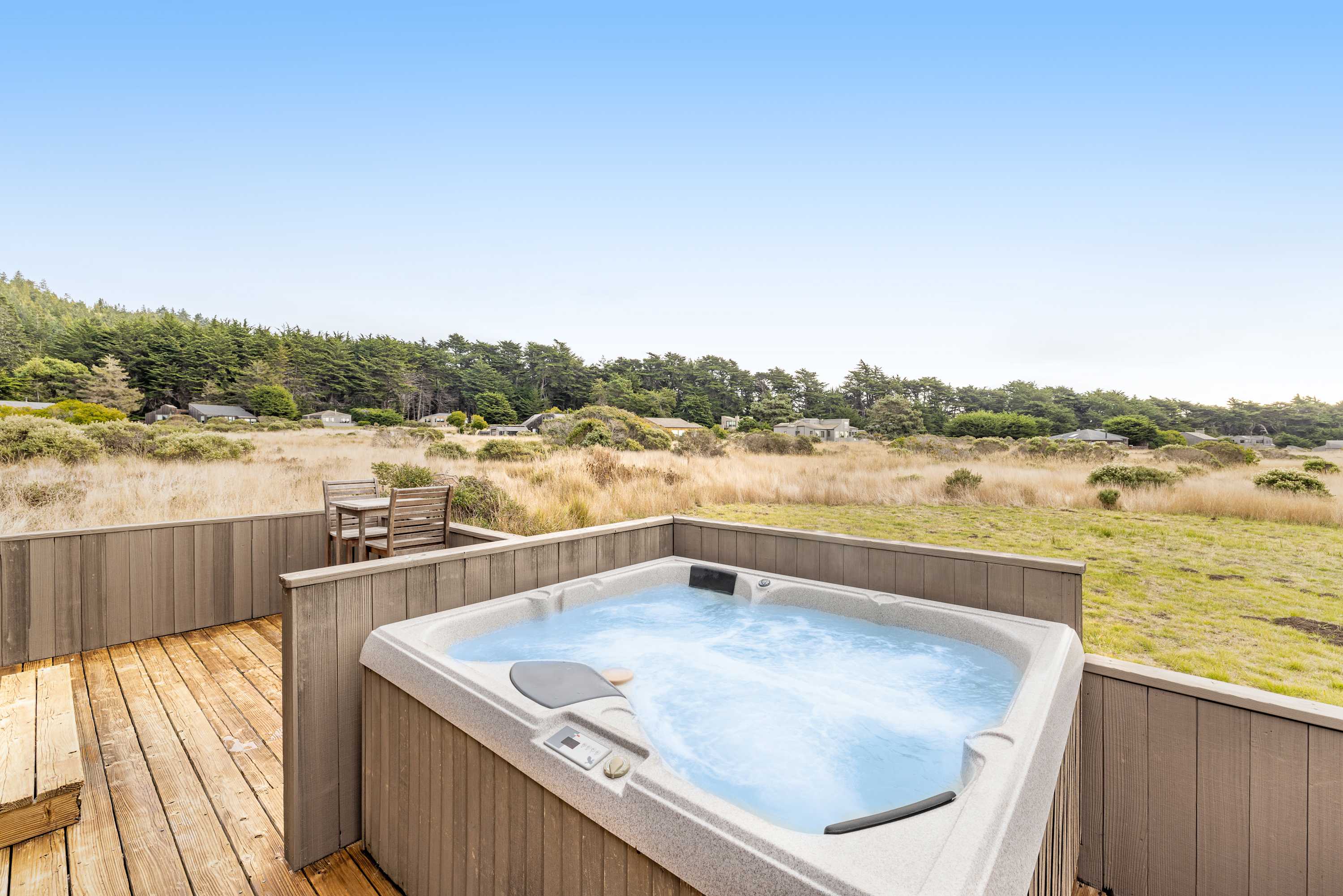 After a day of exploring, unwind in your private hot tub, soaking in the tranquil surroundings as the sun sets over the horizon.