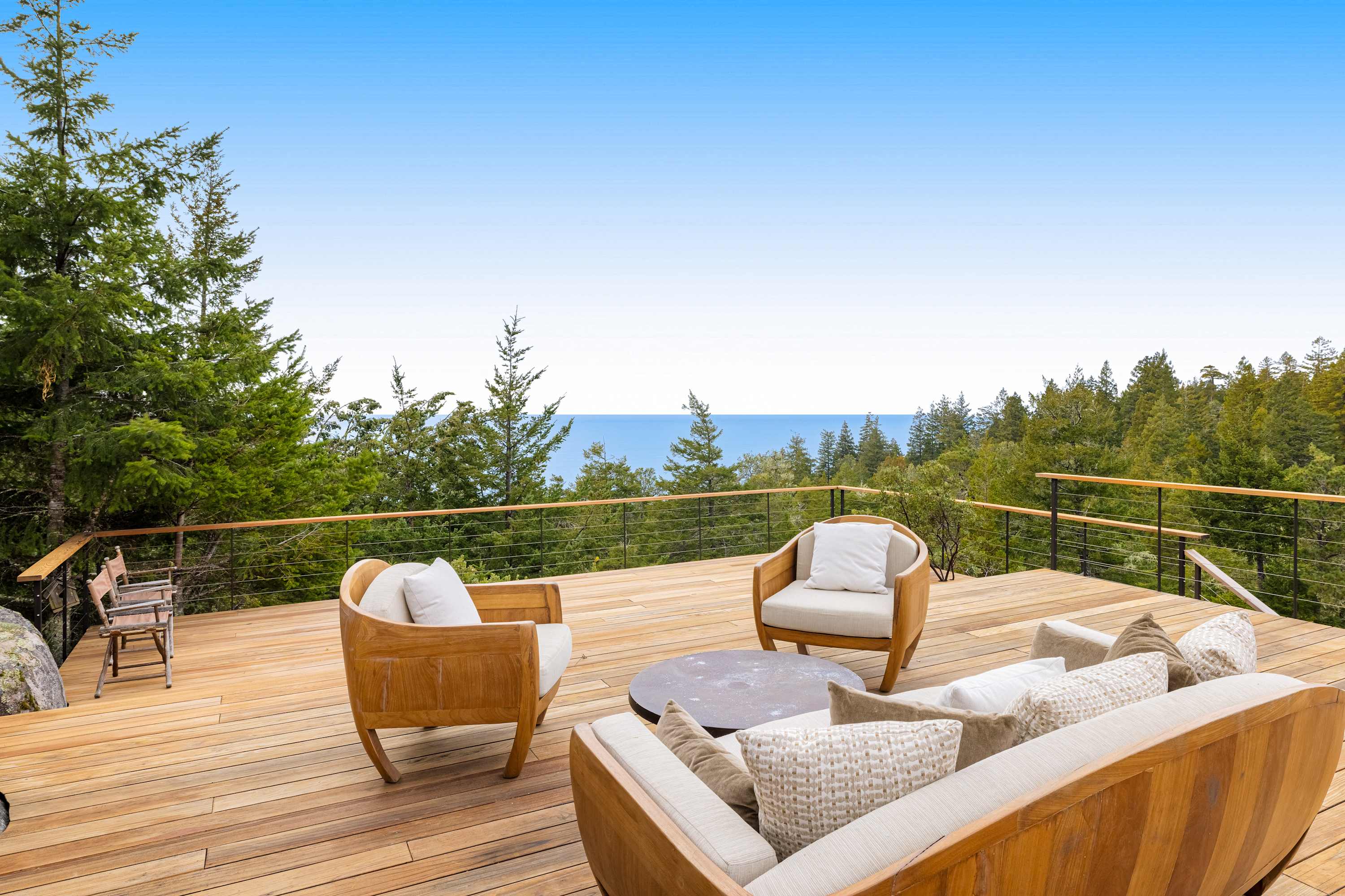 Breathe in the fresh coastal air from your spacious deck, where ocean views set the perfect backdrop for morning coffee or evening stargazing.
