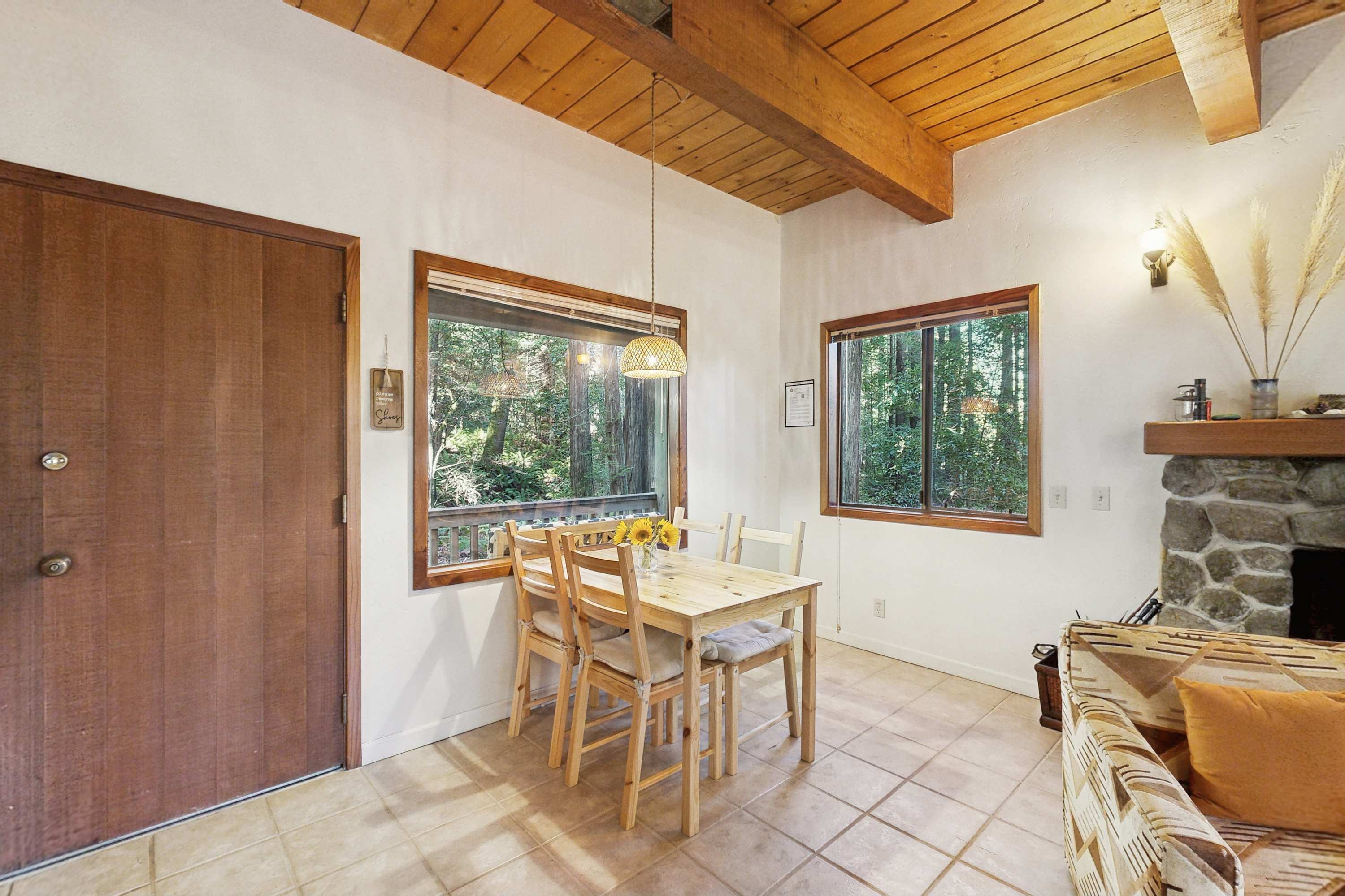 Share meals and memories at this dining table, where forest views enhance your dining experience, making every meal special.