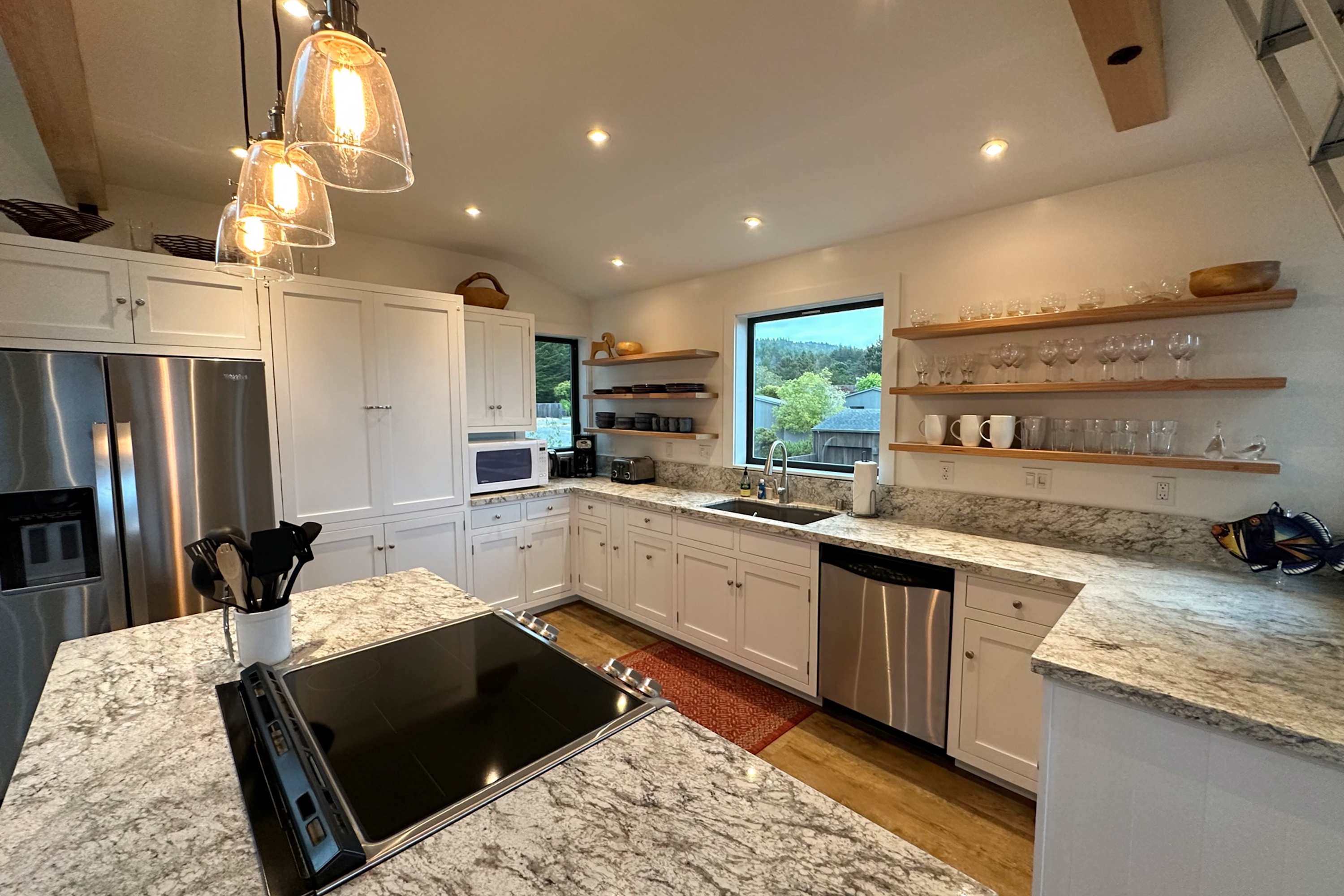 Craft your culinary masterpieces in this modern kitchen, equipped with everything you need for delightful meals during your stay.