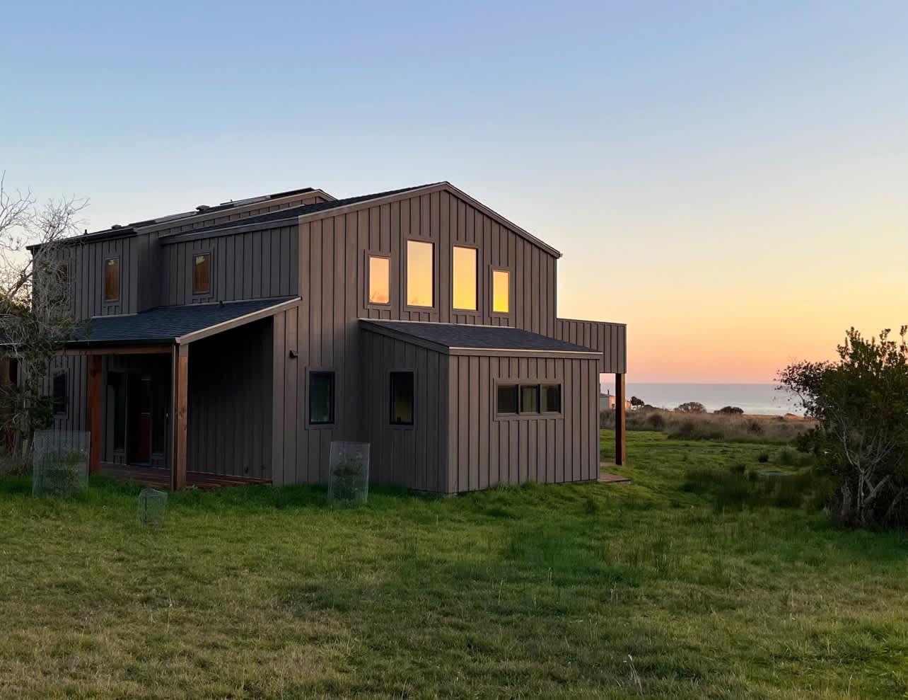 As the sun sets over the ocean, this coastal retreat welcomes you to unwind in its serene surroundings.