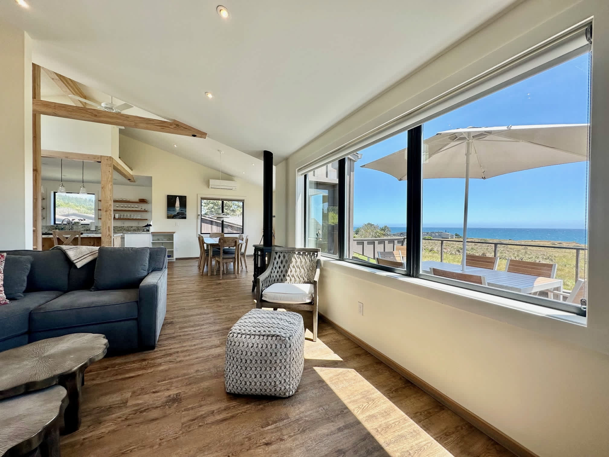 Bask in the warmth of natural light as you relax in the living room, where panoramic ocean views set the perfect ambiance for your getaway.