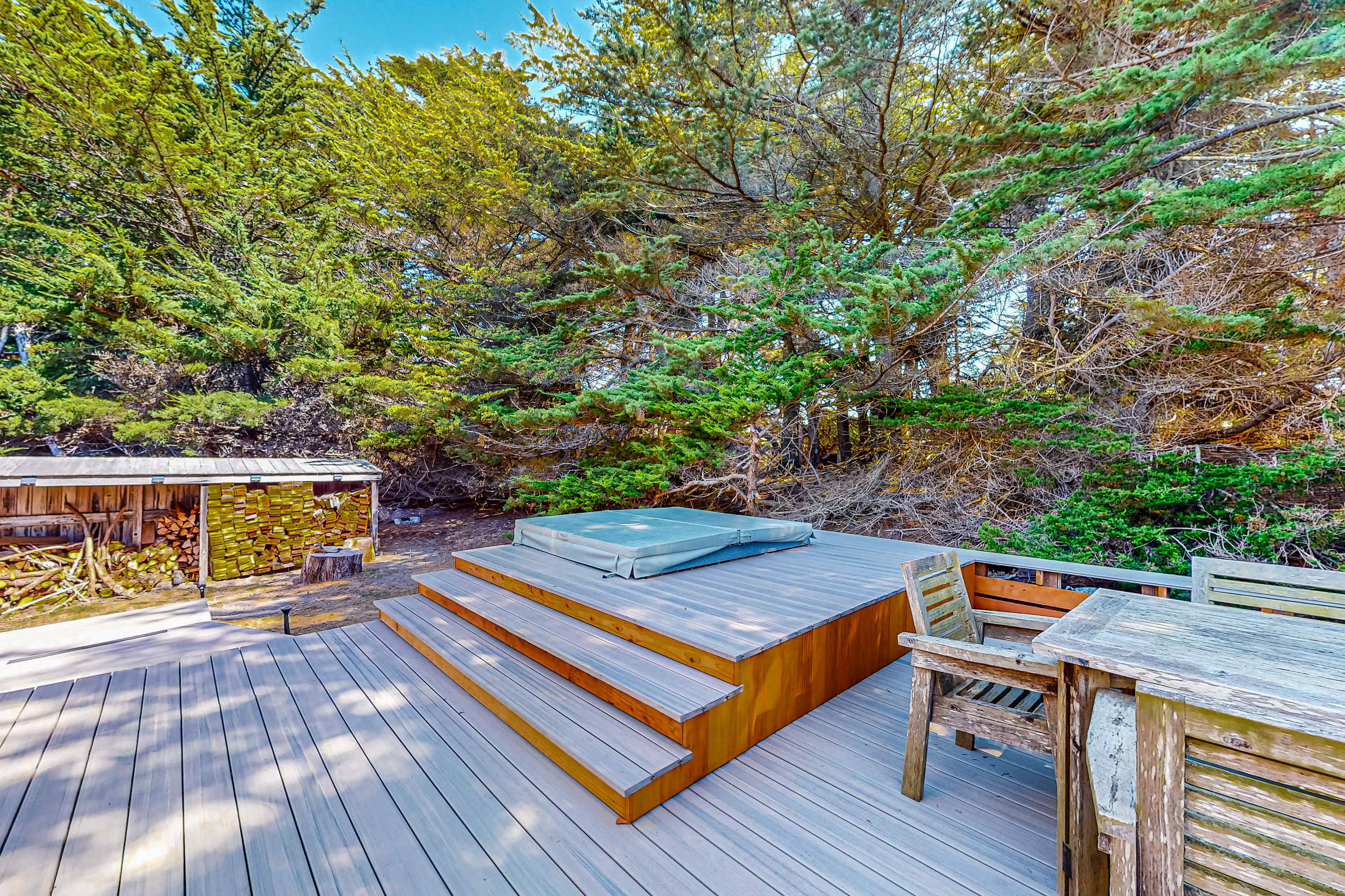 Step into your private hot tub and unwind surrounded by nature—ideal for stargazing after a day of coastal adventures.