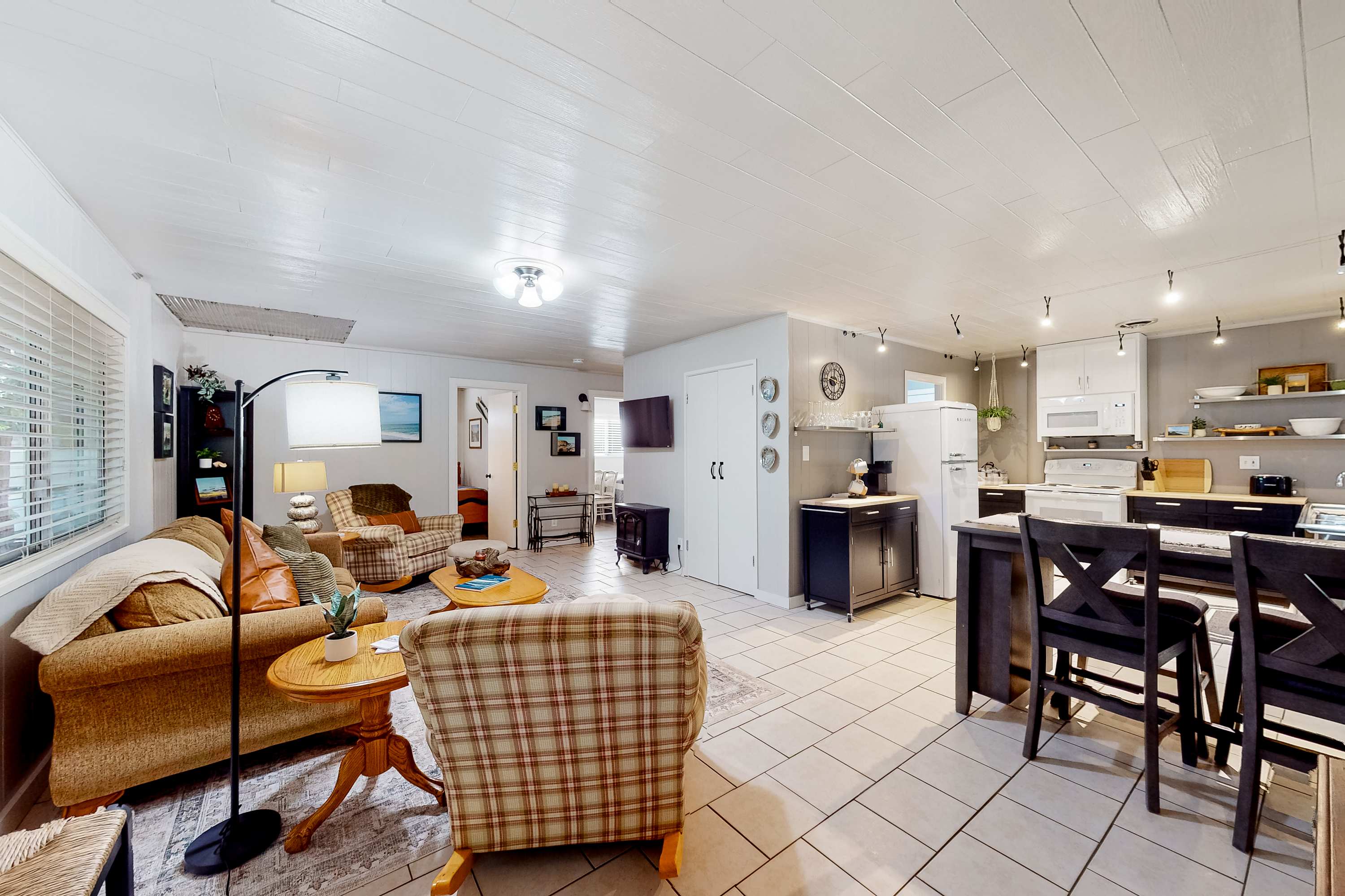 Feel at home in the inviting living room, perfect for cozy evenings with loved ones or a good book by the fire.