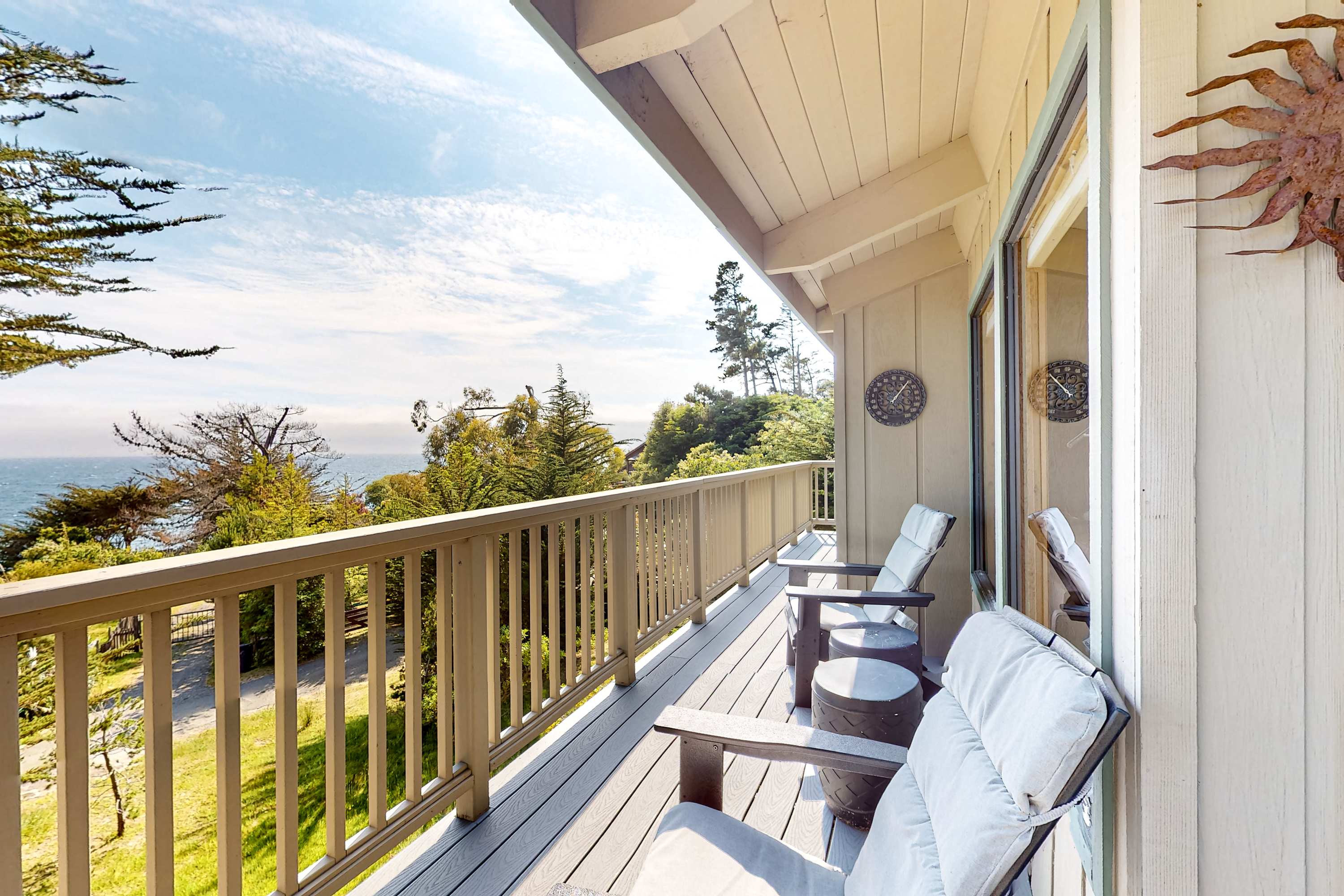 Step onto the spacious deck and savor your morning coffee, surrounded by the serene sounds of nature and breathtaking ocean vistas.