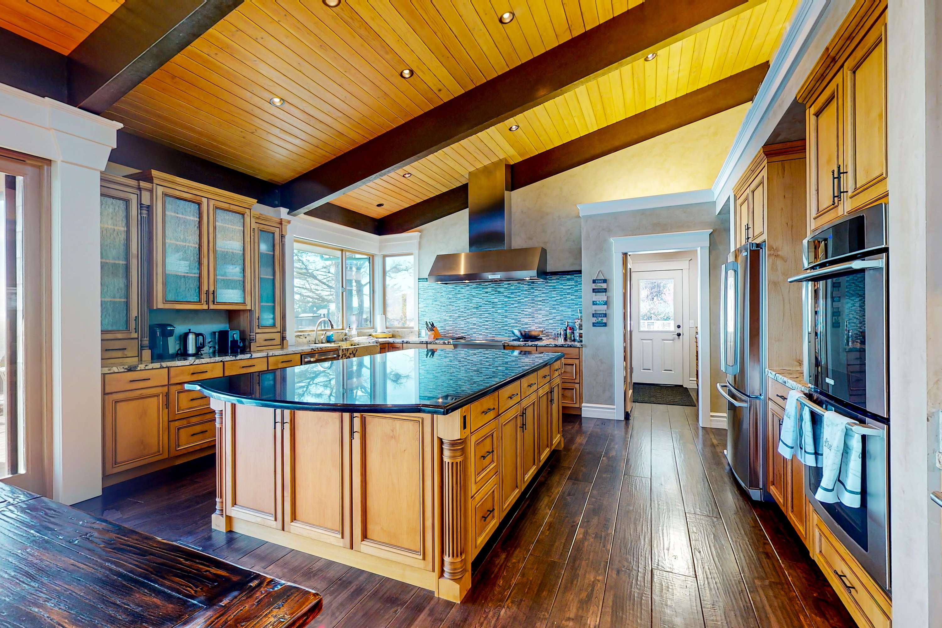 The heart of your vacation awaits in this stylish kitchen, designed for both cooking and enjoying the breathtaking scenery.