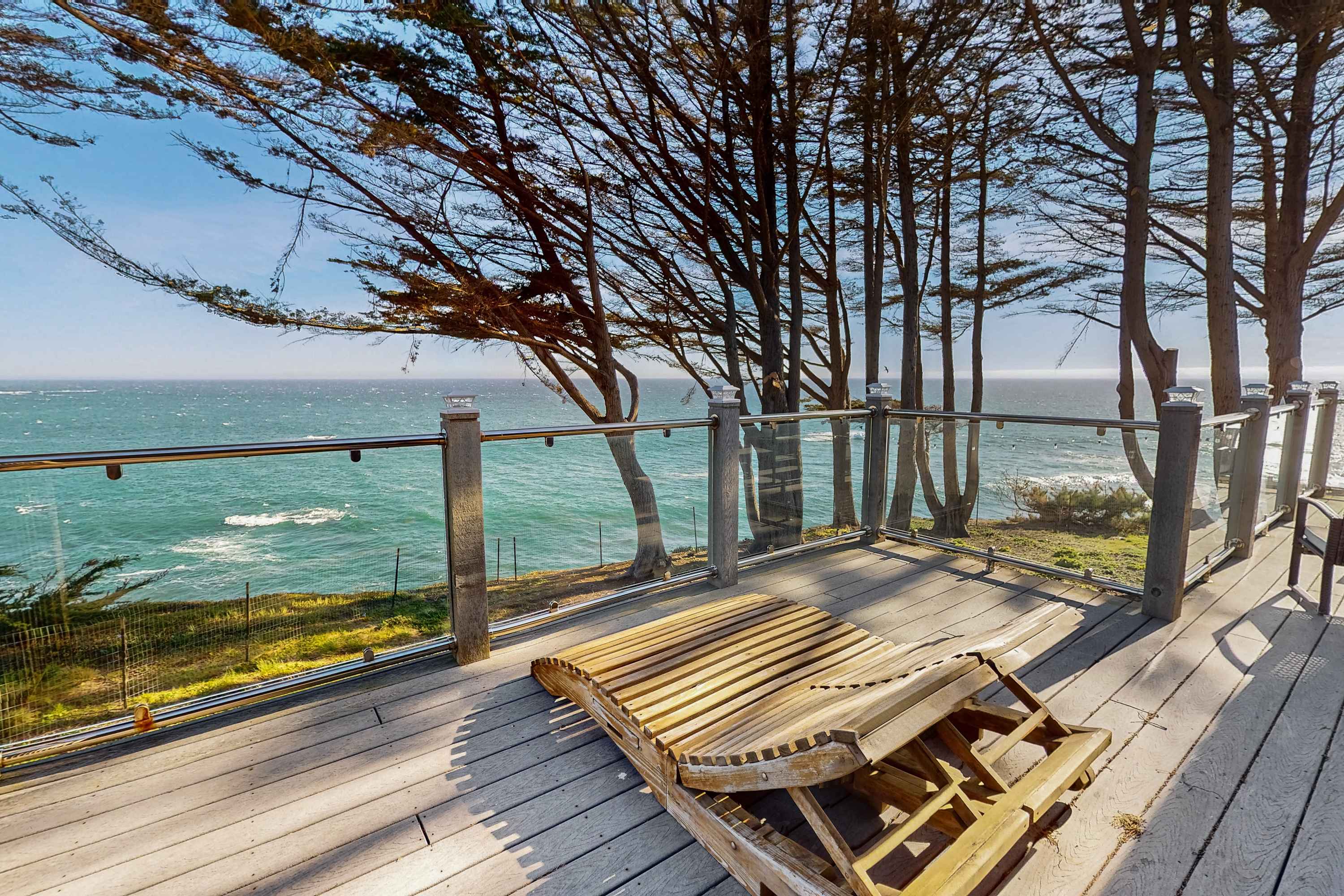 Relax on this sun-drenched deck, where the gentle sway of the trees and the sound of waves create the perfect setting for lazy afternoons.