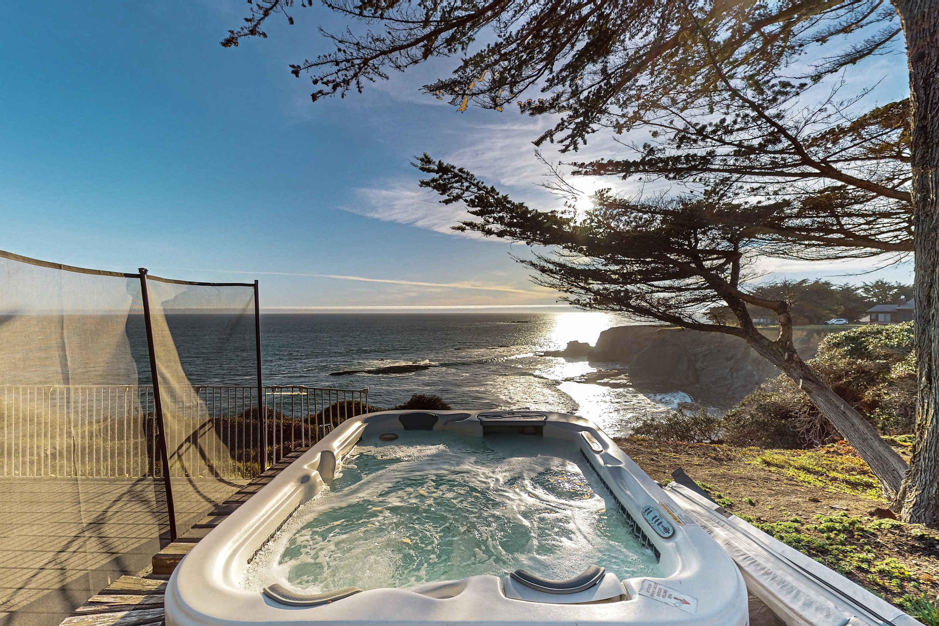 Soak in the private hot tub as the sun sets over the Pacific, turning your getaway into a serene, unforgettable experience.