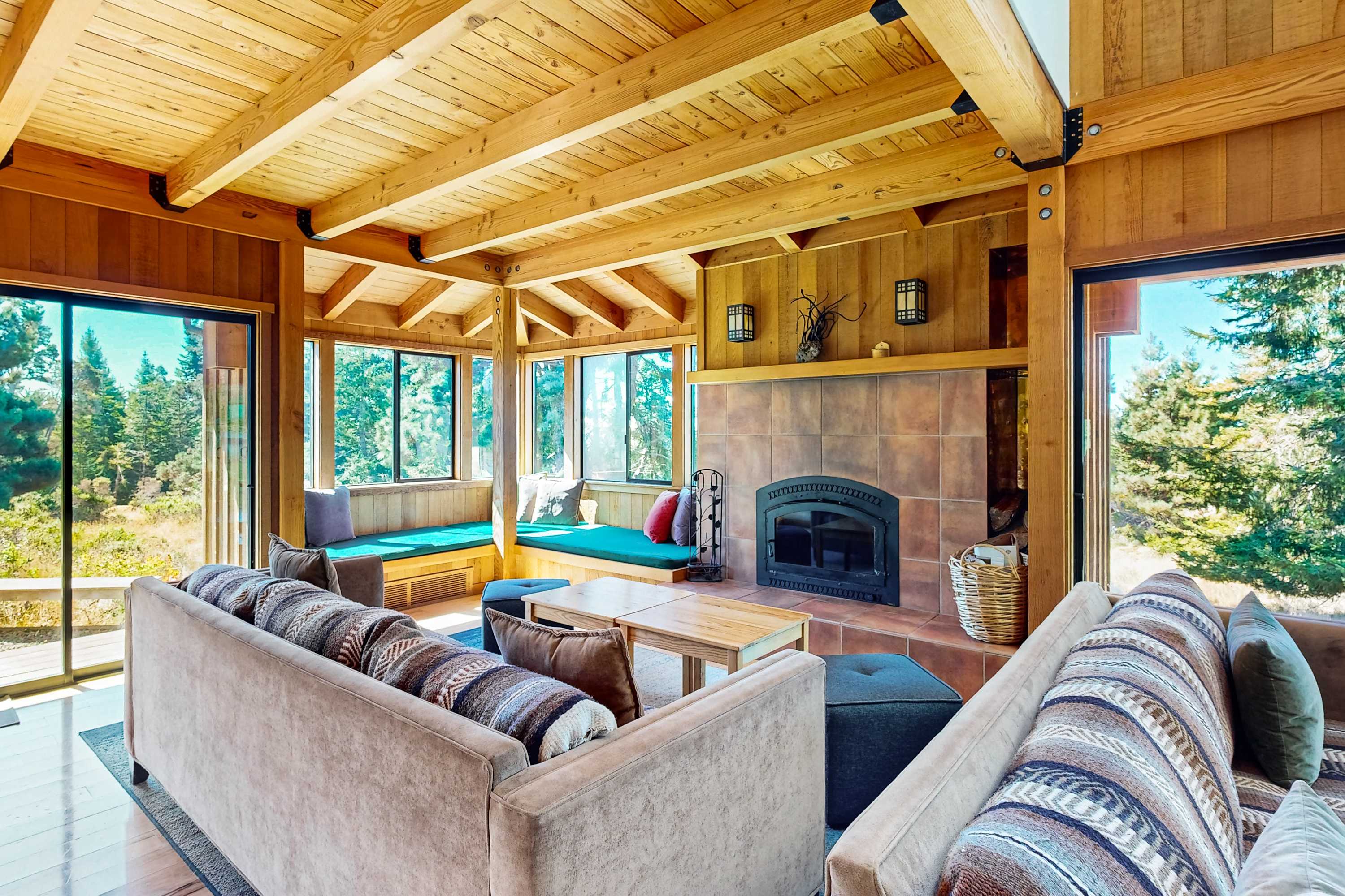 Bask in the warmth of the fireplace while taking in the breathtaking views from this stylish living room.