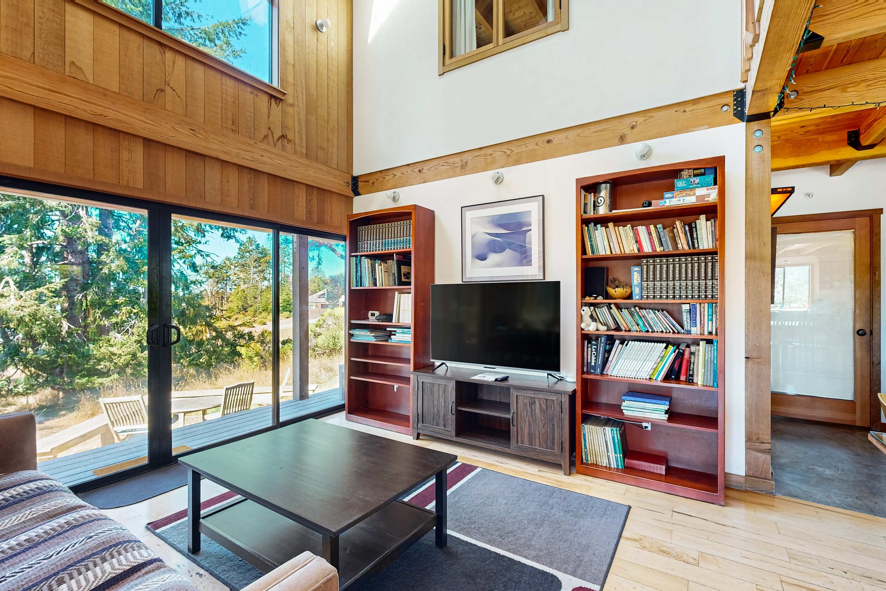 Relax in this serene living space, where books and entertainment await after a day of exploring the coast.