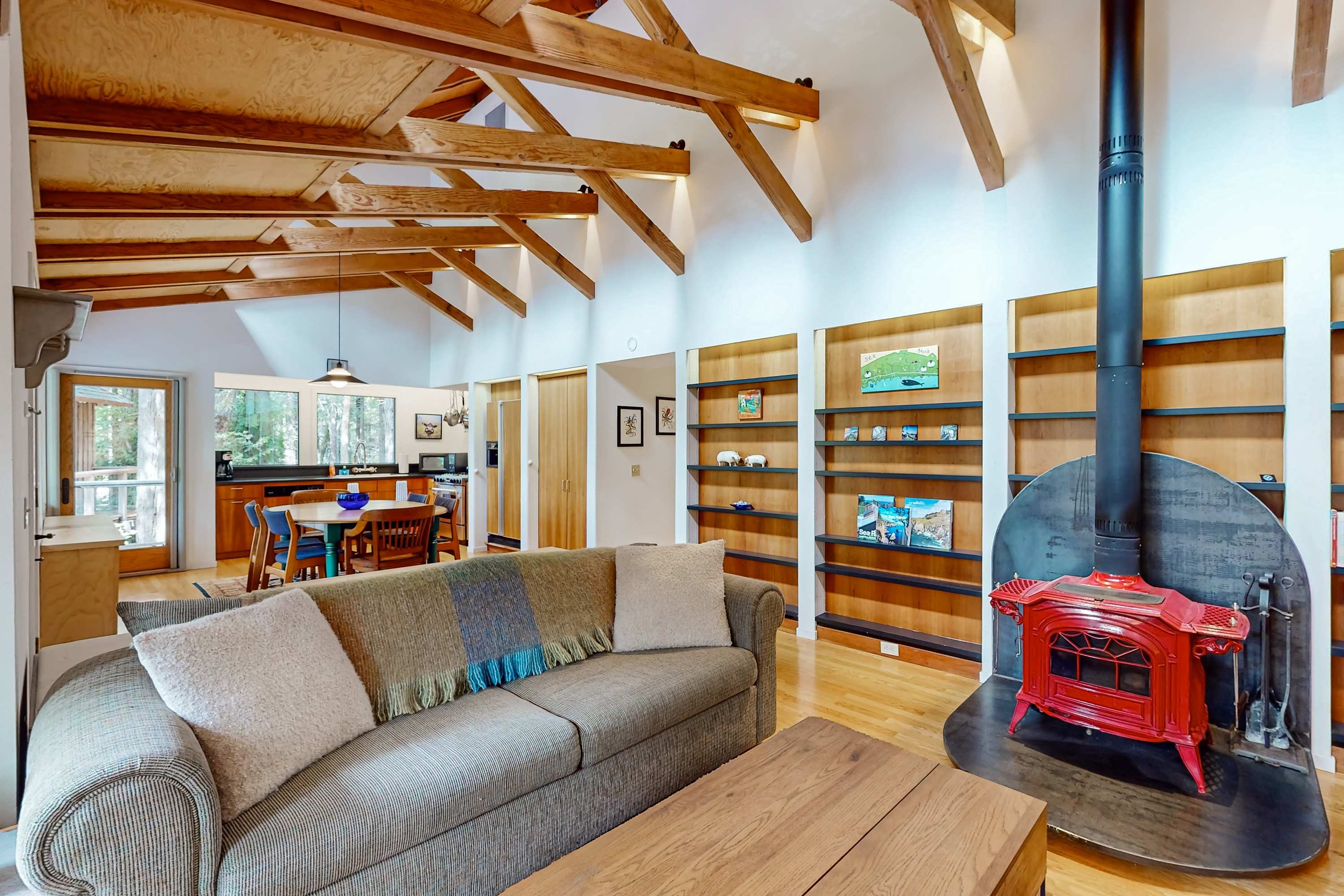 Gather around the warmth of the red wood stove, creating a perfect ambiance for game nights or quiet retreats.
