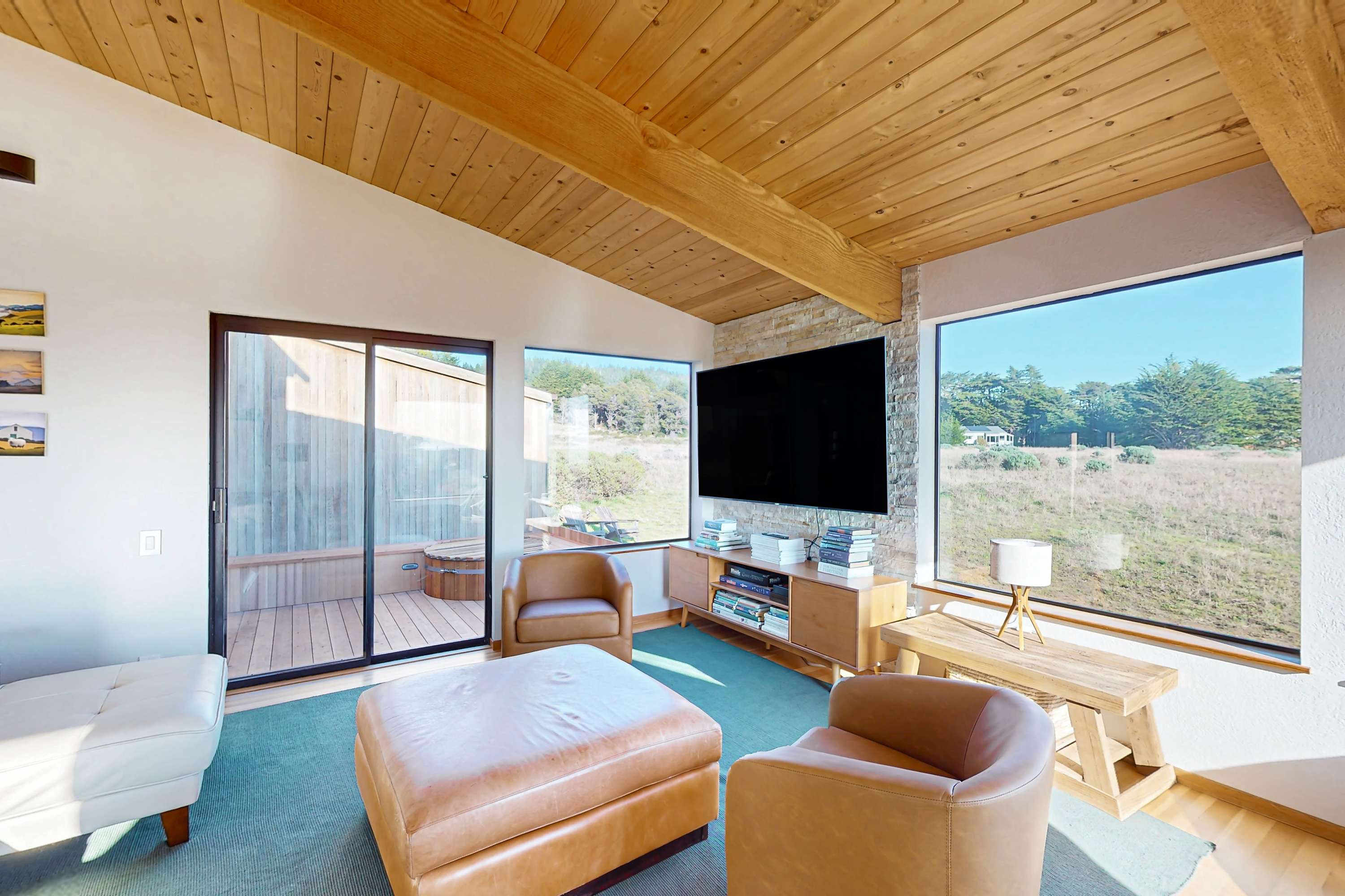 Gaze out at the serene landscape from this cozy nook, perfect for reading or enjoying a quiet moment with loved ones.
