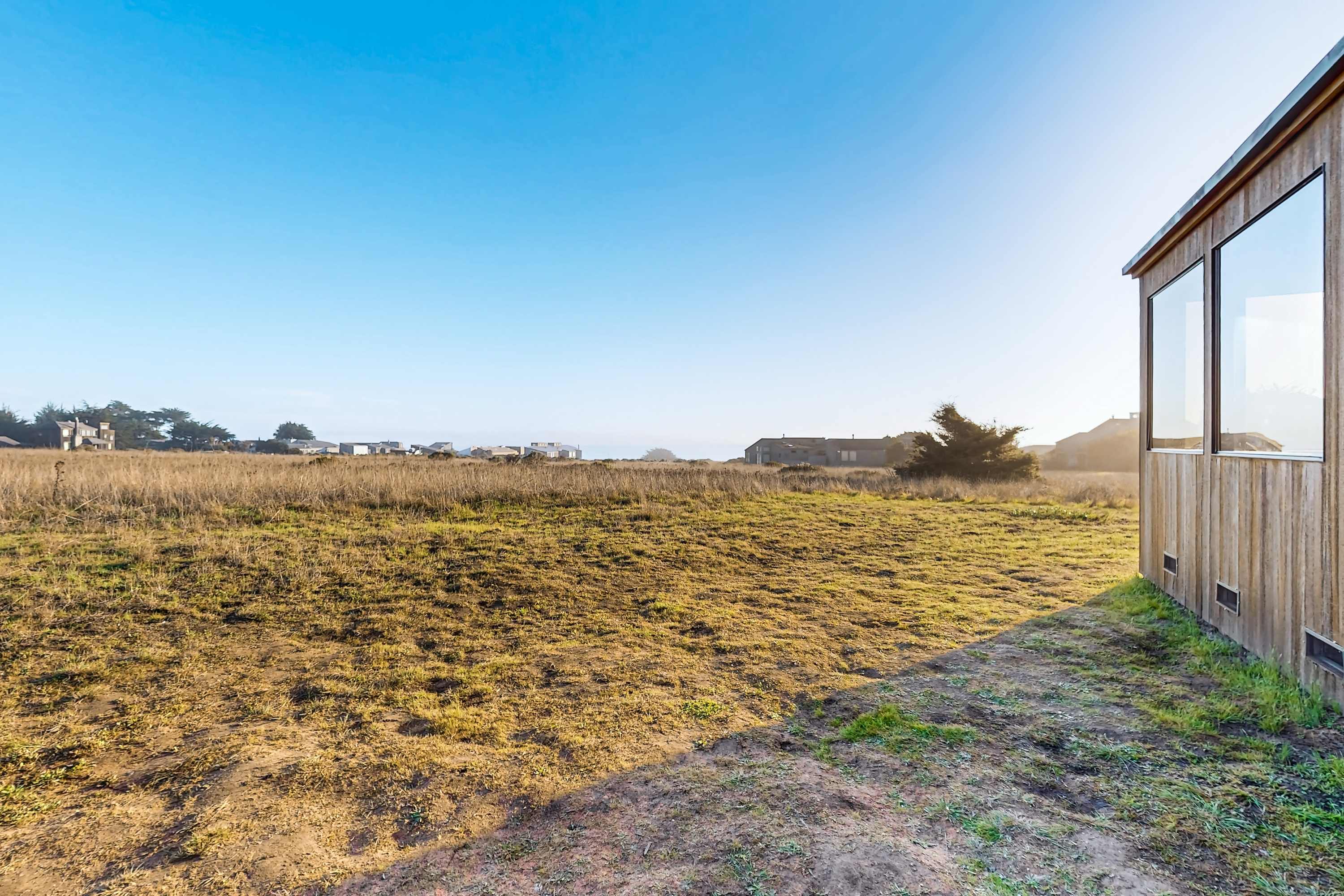 Gaze across the expansive landscape from this vantage point, where rolling hills meet the horizon, offering endless inspiration for exploration.