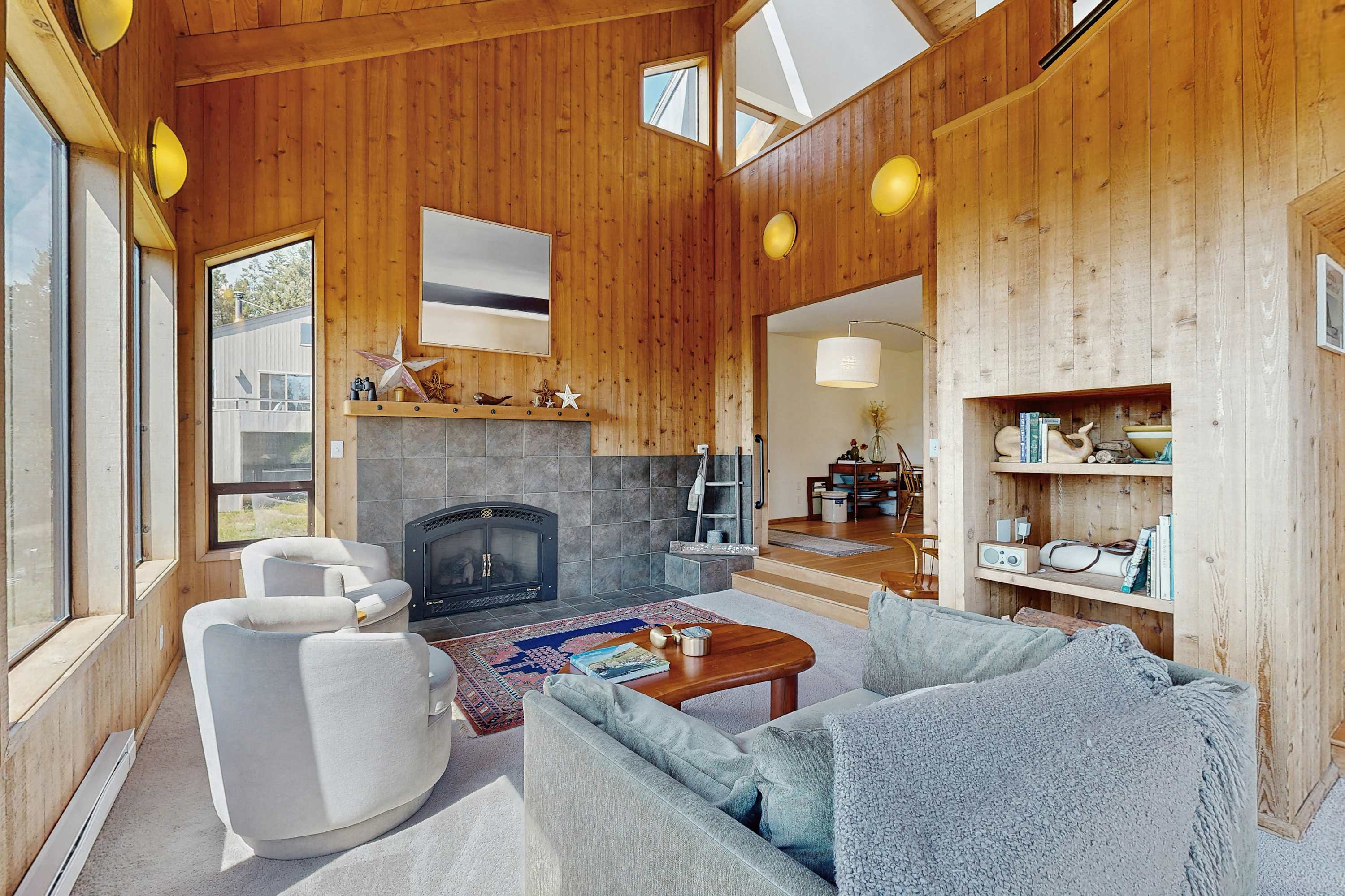 Gather around the cozy gas fireplace in the living room, a perfect setting for evening chats and movie nights.