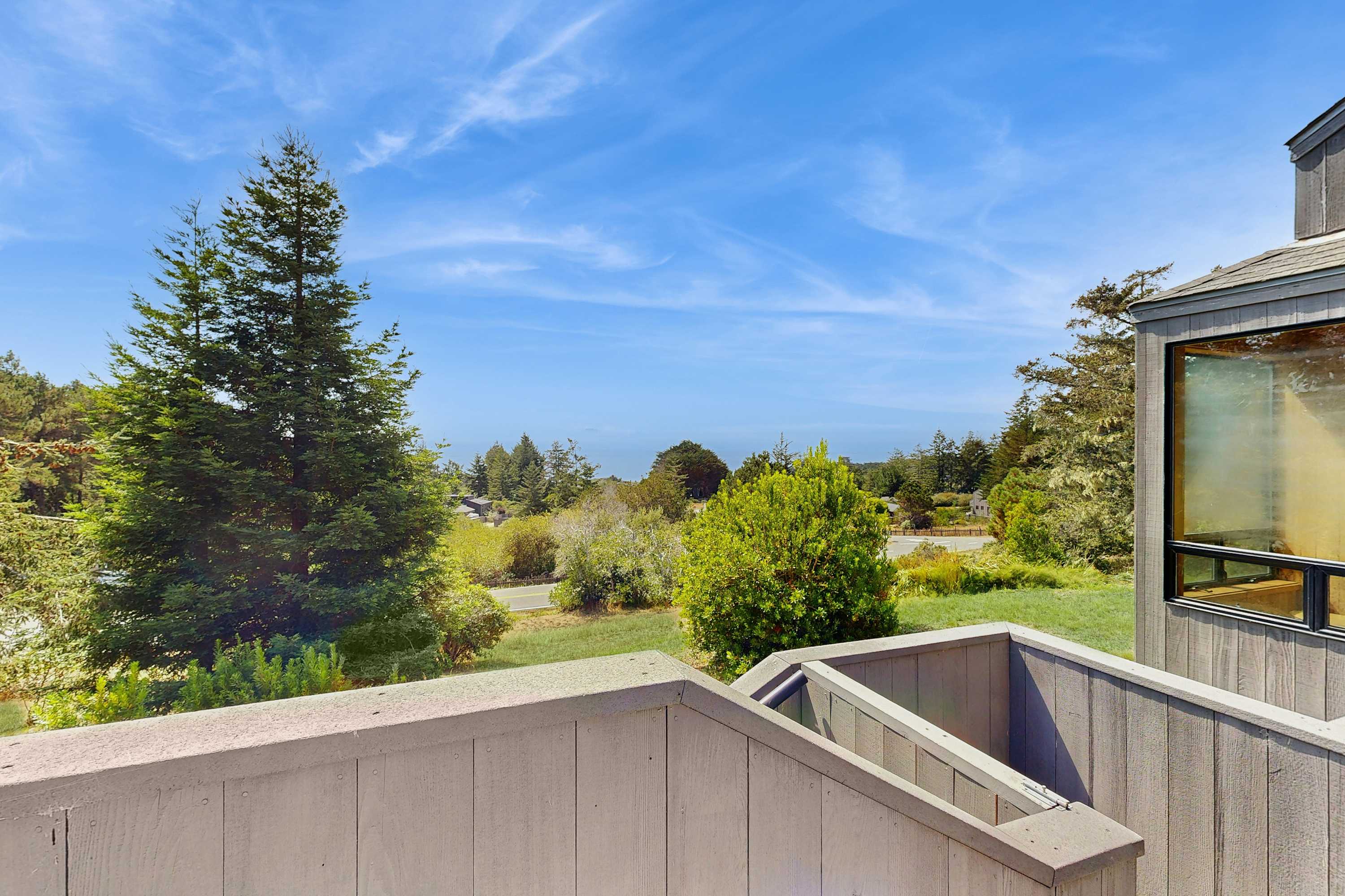Gaze at the endless ocean from your private balcony, where lush greenery meets breathtaking views, inviting you to embrace the coastal lifestyle.