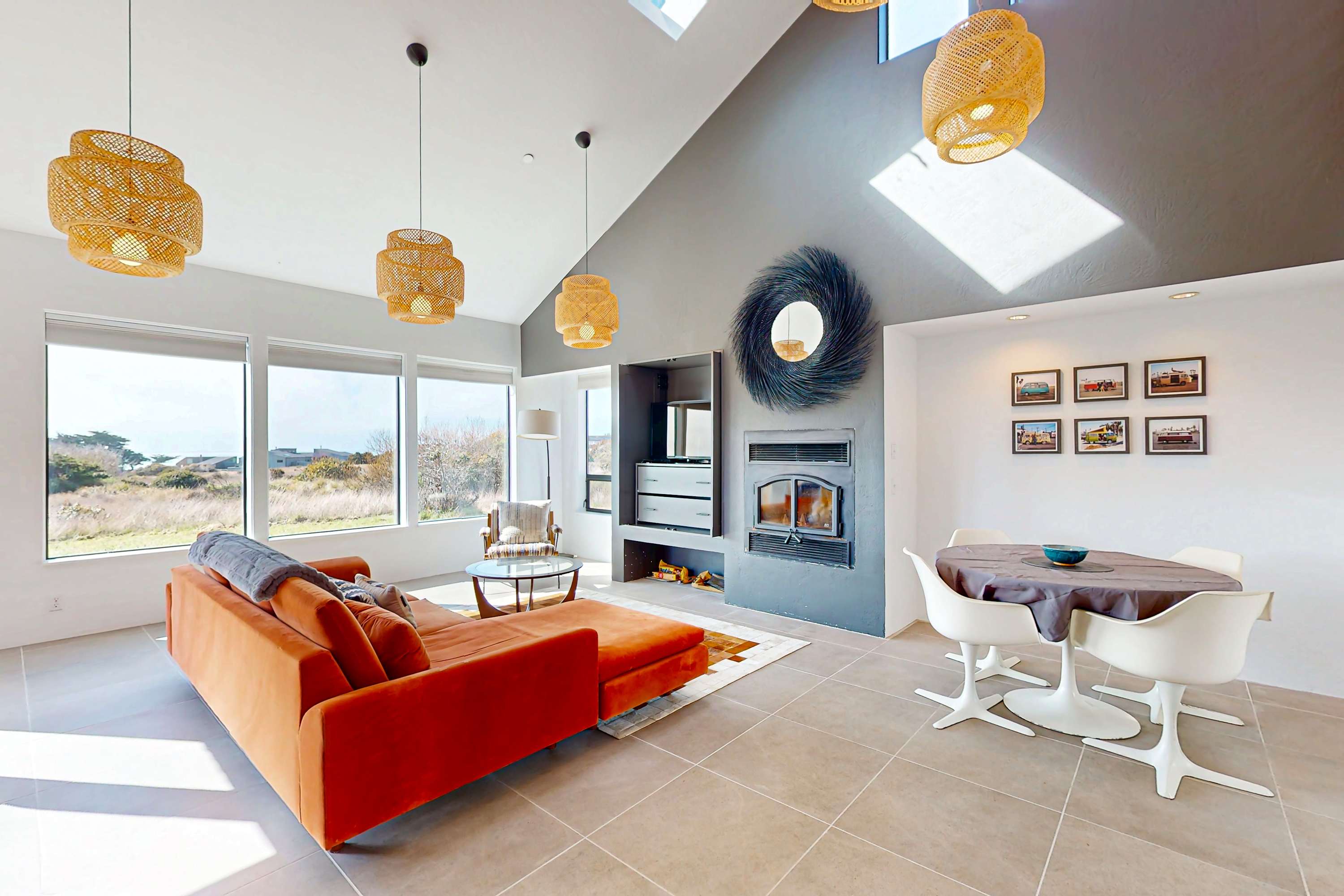 Gather in the spacious living room, where natural light floods the space, creating a warm atmosphere for cozy evenings by the wood-burning fireplace.