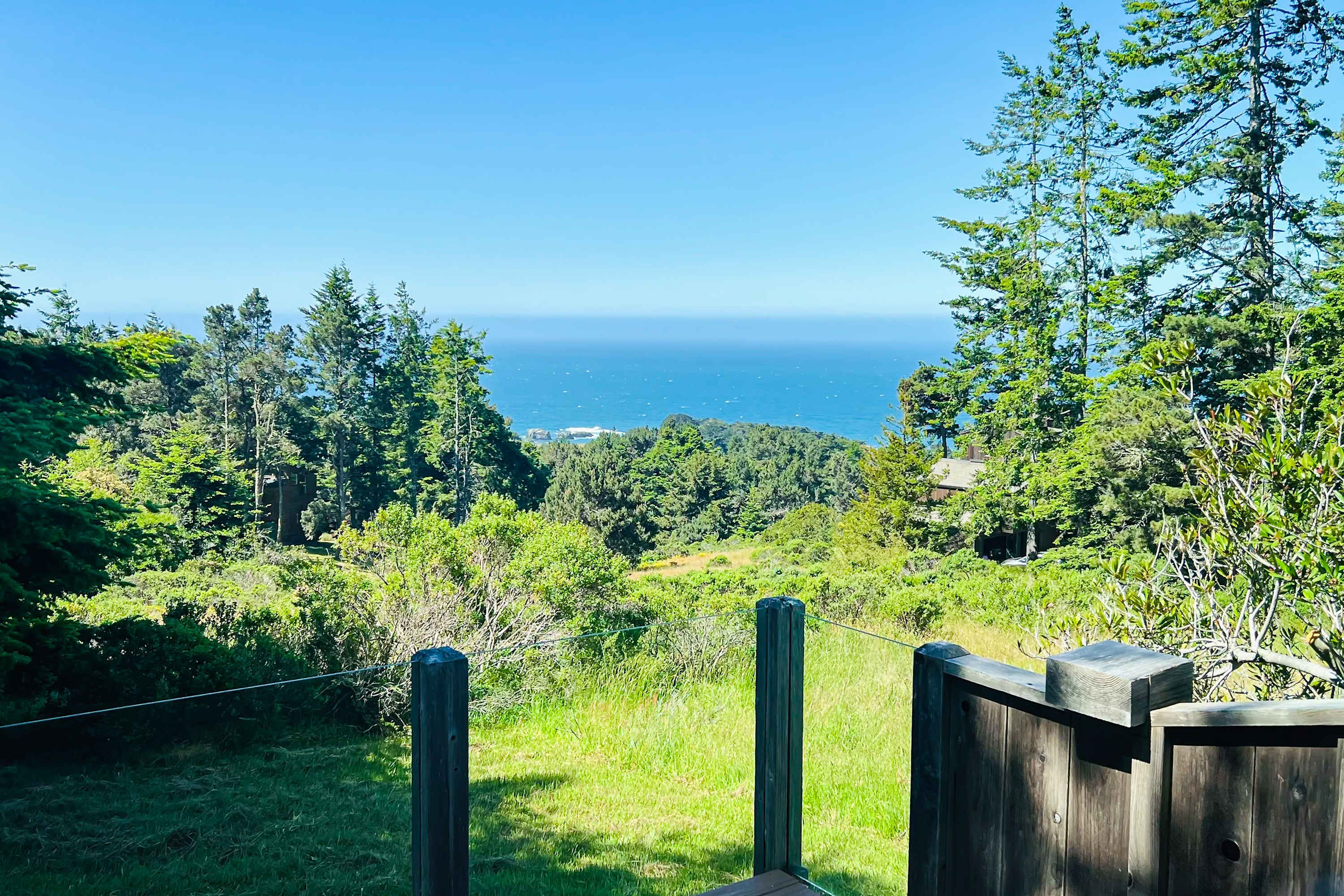 Gaze out toward the horizon from your private oasis, surrounded by lush greenery and the calming sounds of the ocean.