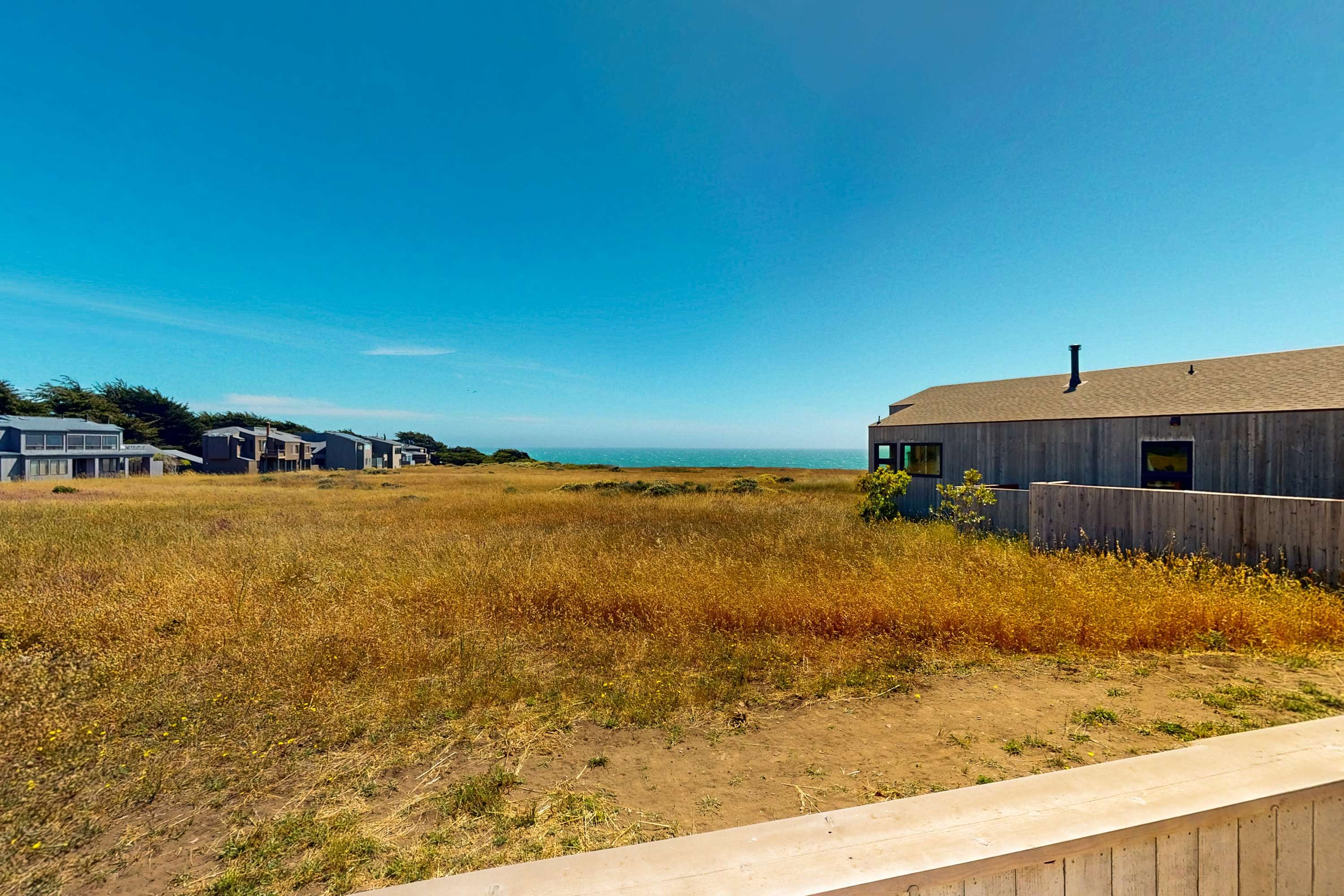 Gaze at the expansive landscape from your deck, where the sound of waves and sea breeze create a peaceful retreat.