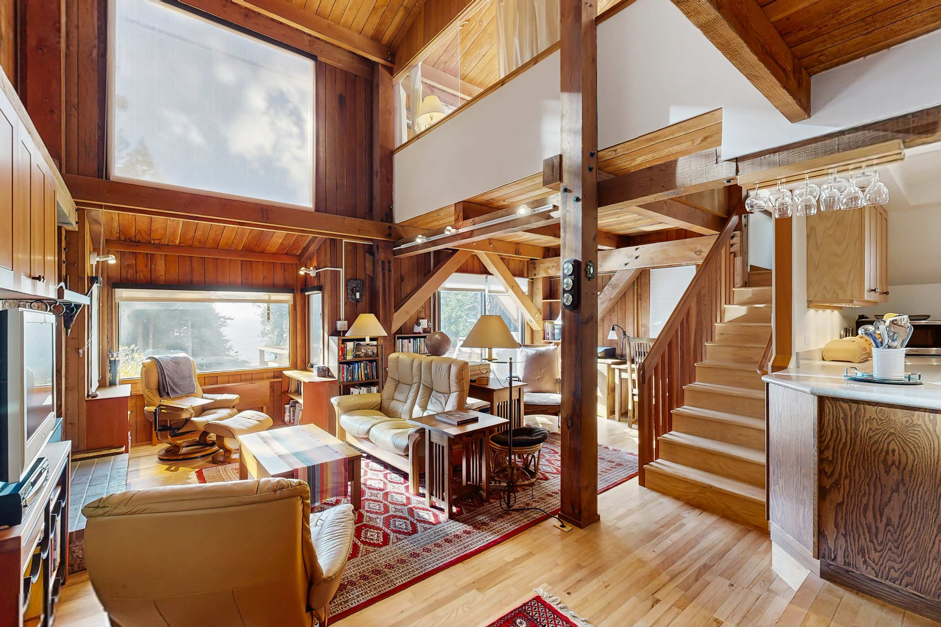 Morning light spills into the living room, inviting you to relax with a book or gather with loved ones by the gas fireplace.