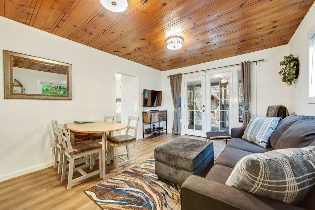 Gather around the TV for movie night or spread out with a good book on the plush sectional. Warm wood tones and soft textiles make this room irresistibly comfortable.