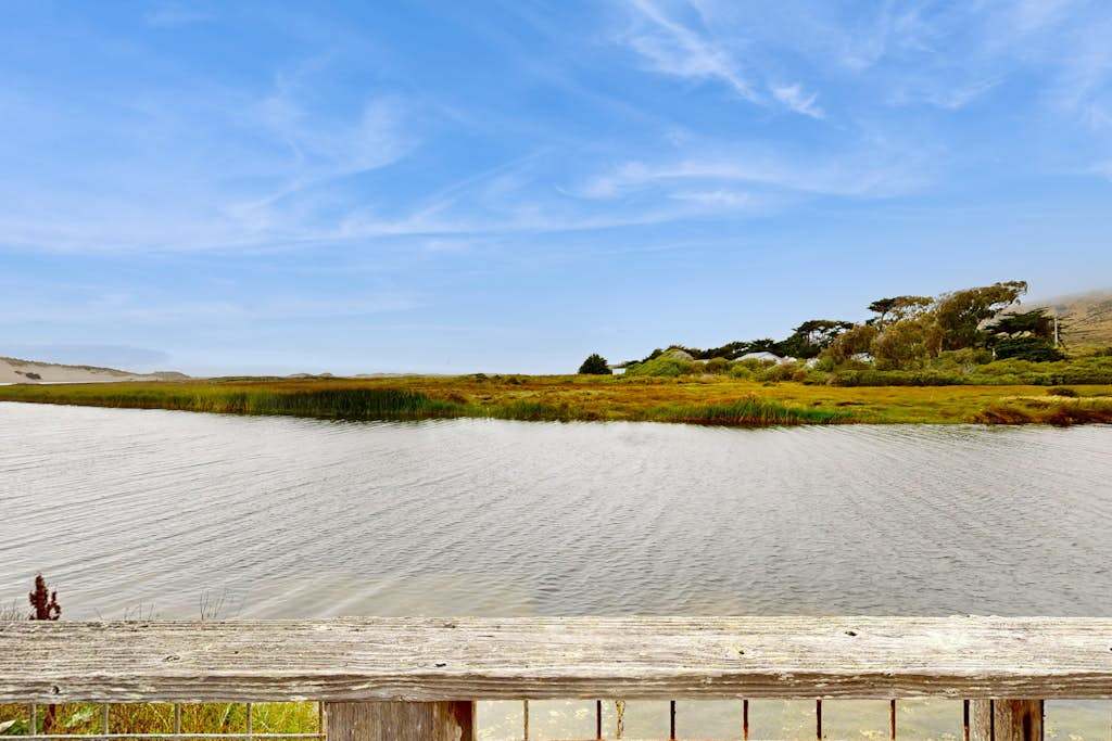 From your deck, savor sweeping views across Salmon Creek estuary where coastal marshlands meet the Sonoma Coast sky.