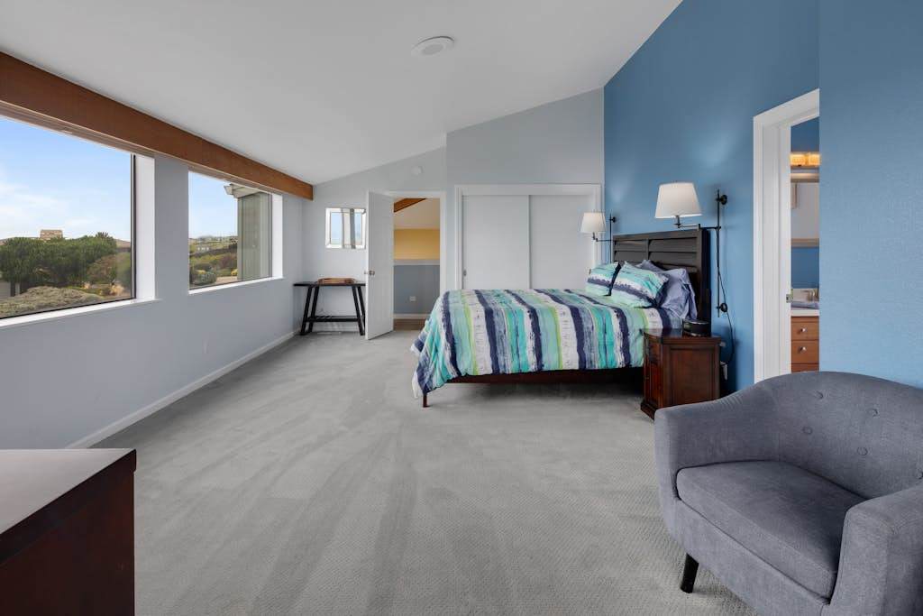 Wake to ocean breezes in this spacious king suite with panoramic windows framing the Sonoma coastline.