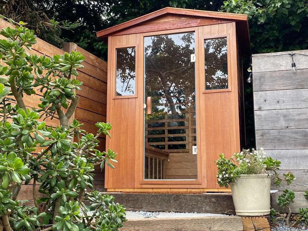 Warm up in your private outdoor sauna nestled among lush garden greenery — the ultimate Sonoma Coast indulgence.