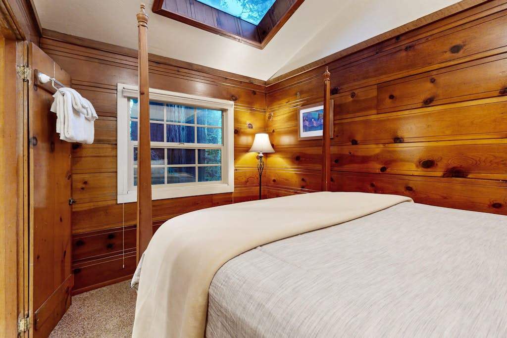 Retreat to your wood-paneled queen bedroom with skylight views of the redwood canopy overhead.