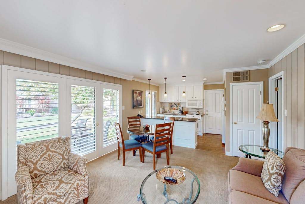 Gather your group in the bright open-concept living and dining space with views of the resort grounds through oversized windows