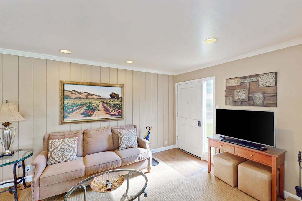 Settle into your cozy living room with wine country artwork, a flat-screen TV, and plush seating after a day of Napa tastings