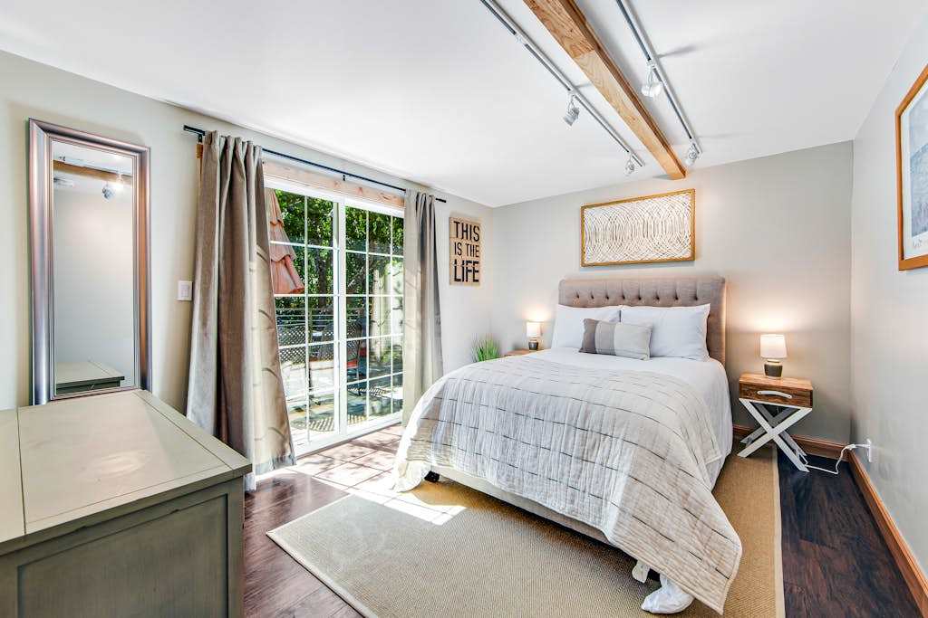 Wake to dappled orchard light through your sliding glass door — step right onto the deck for morning coffee