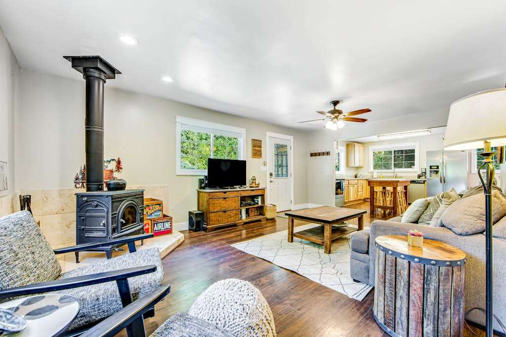 Gather around the wood-burning stove after a day exploring Forestville wineries — your cozy wine country living room awaits